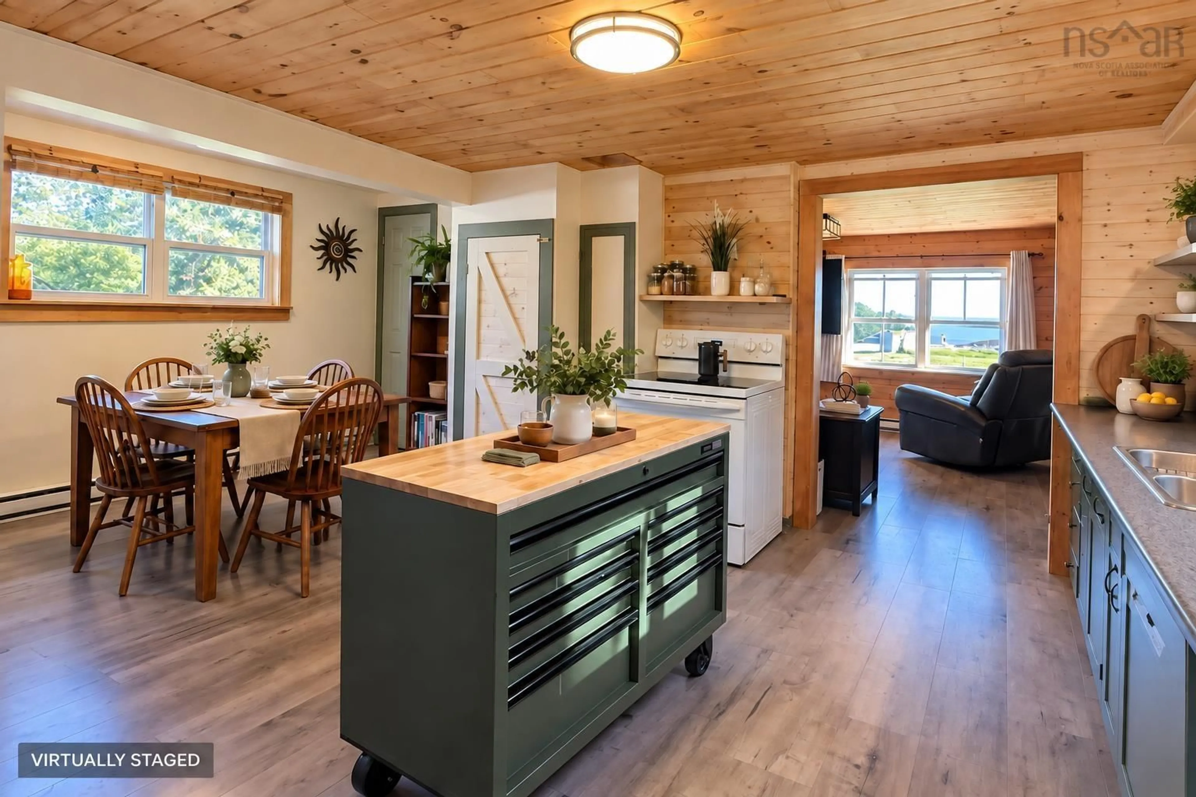 Open concept kitchen, wood/laminate floor for 96 Ocean View Drive, Neils Harbour Nova Scotia B0C 1G0