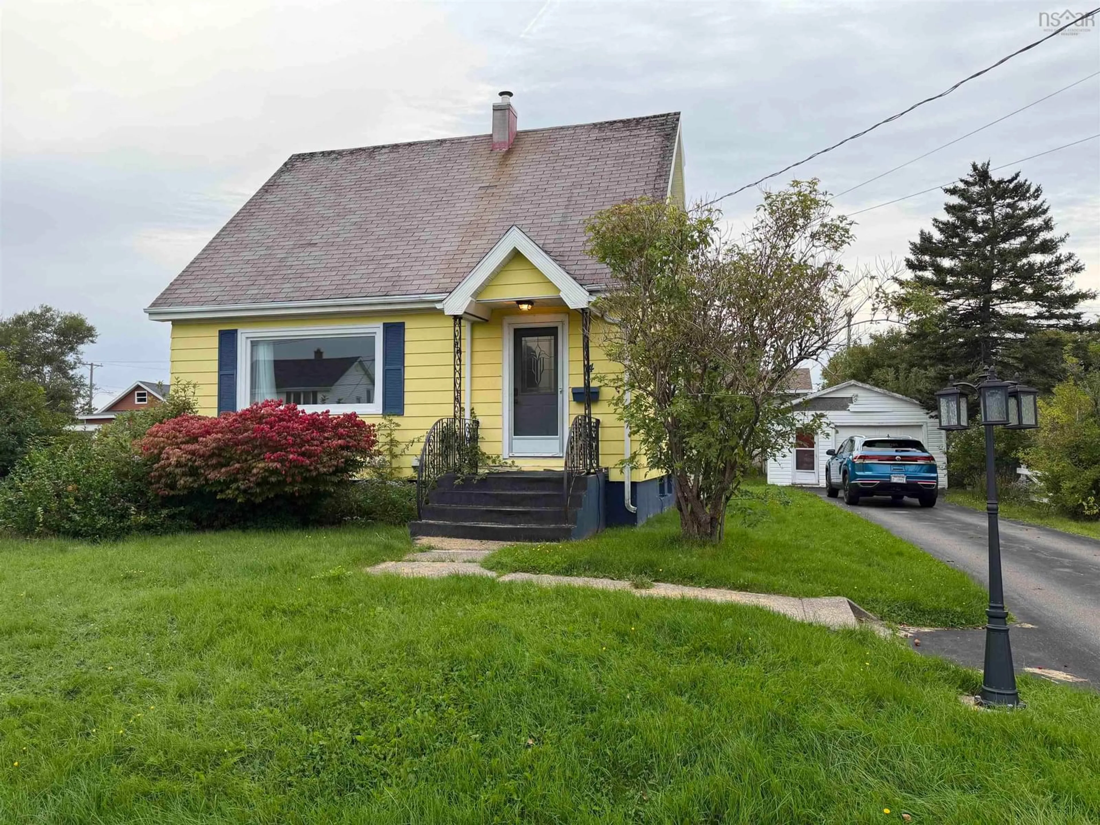 Home with vinyl exterior material, street for 14 Rosewood Ave, Glace Bay Nova Scotia B1A 2Y3
