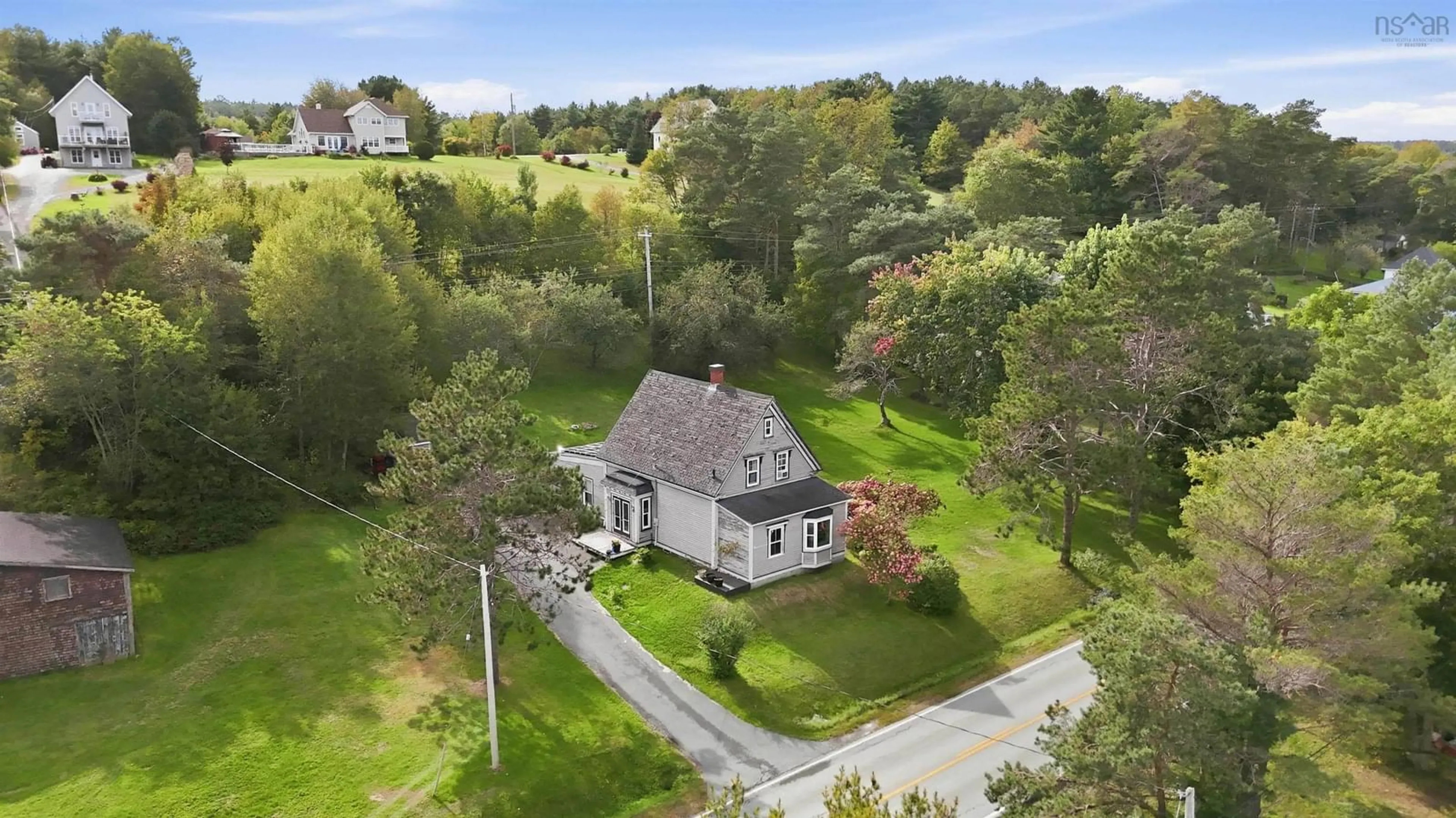A pic from outside/outdoor area/front of a property/back of a property/a pic from drone, street for 1848 Highway 331, West Lahave Nova Scotia B0R 1G0