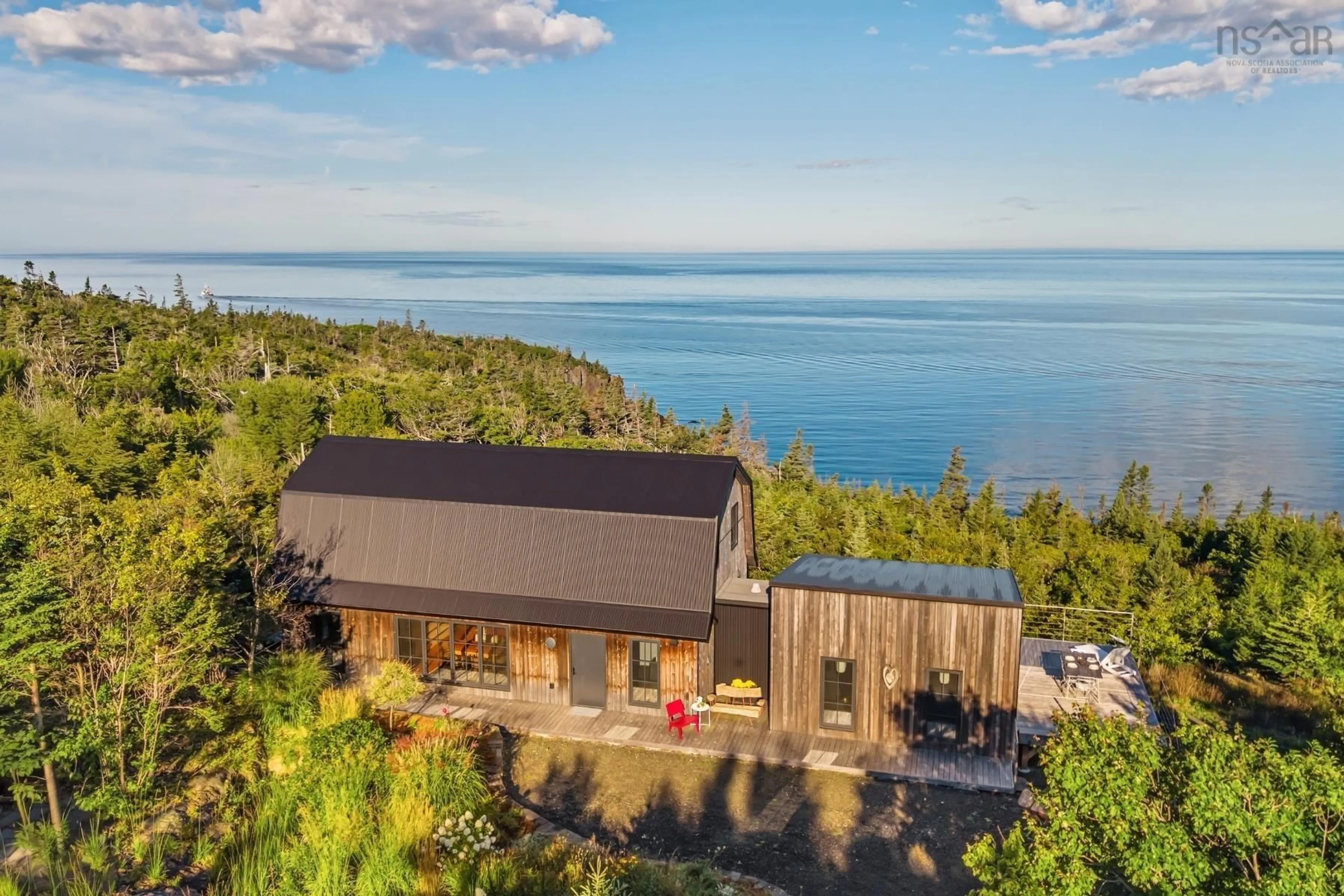 A pic from outside/outdoor area/front of a property/back of a property/a pic from drone, water/lake/river/ocean view for 6941 217 Hwy, Lake Midway Nova Scotia B0V 1A0