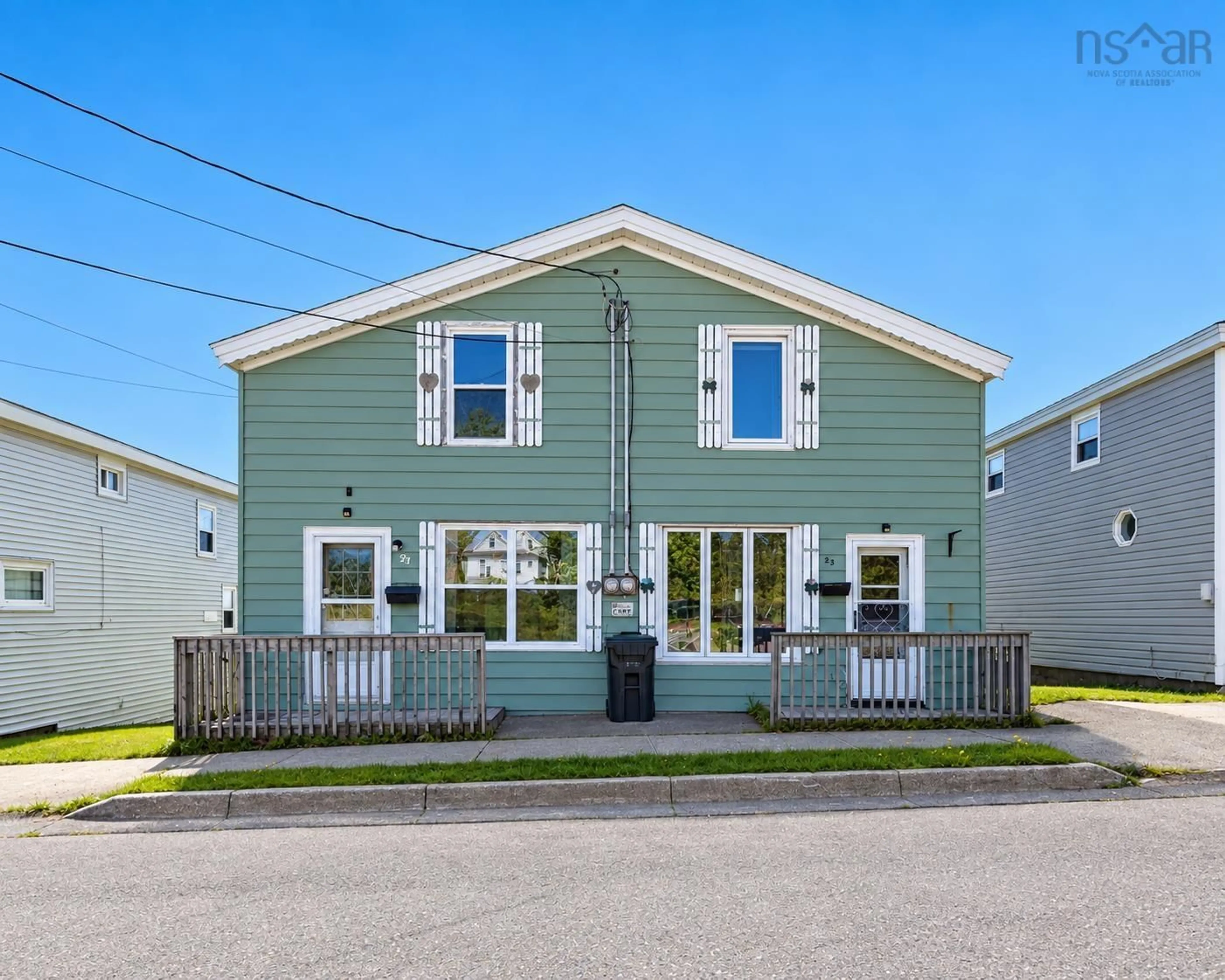 Home with vinyl exterior material, street for 21 Railroad St, Whitney Pier Nova Scotia B1N 2B3