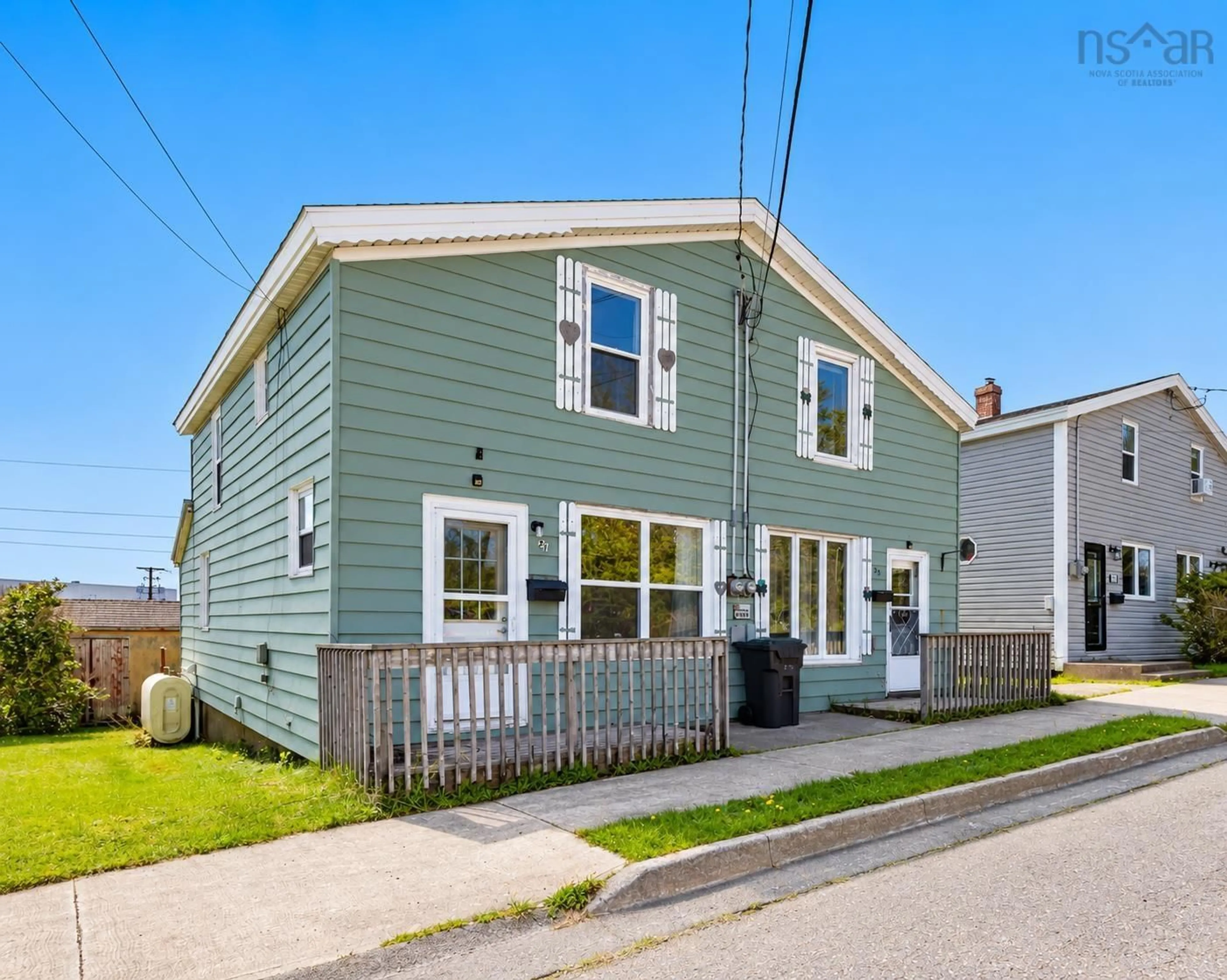 Home with vinyl exterior material, street for 21 Railroad St, Whitney Pier Nova Scotia B1N 2B3