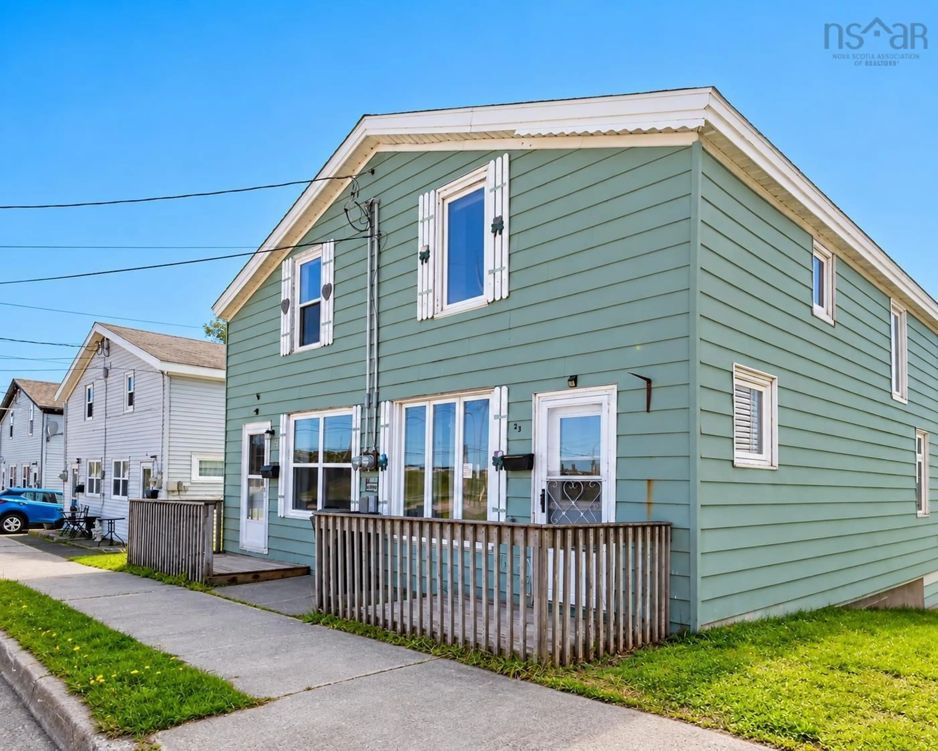 Home with vinyl exterior material, street for 21 Railroad St, Whitney Pier Nova Scotia B1N 2B3