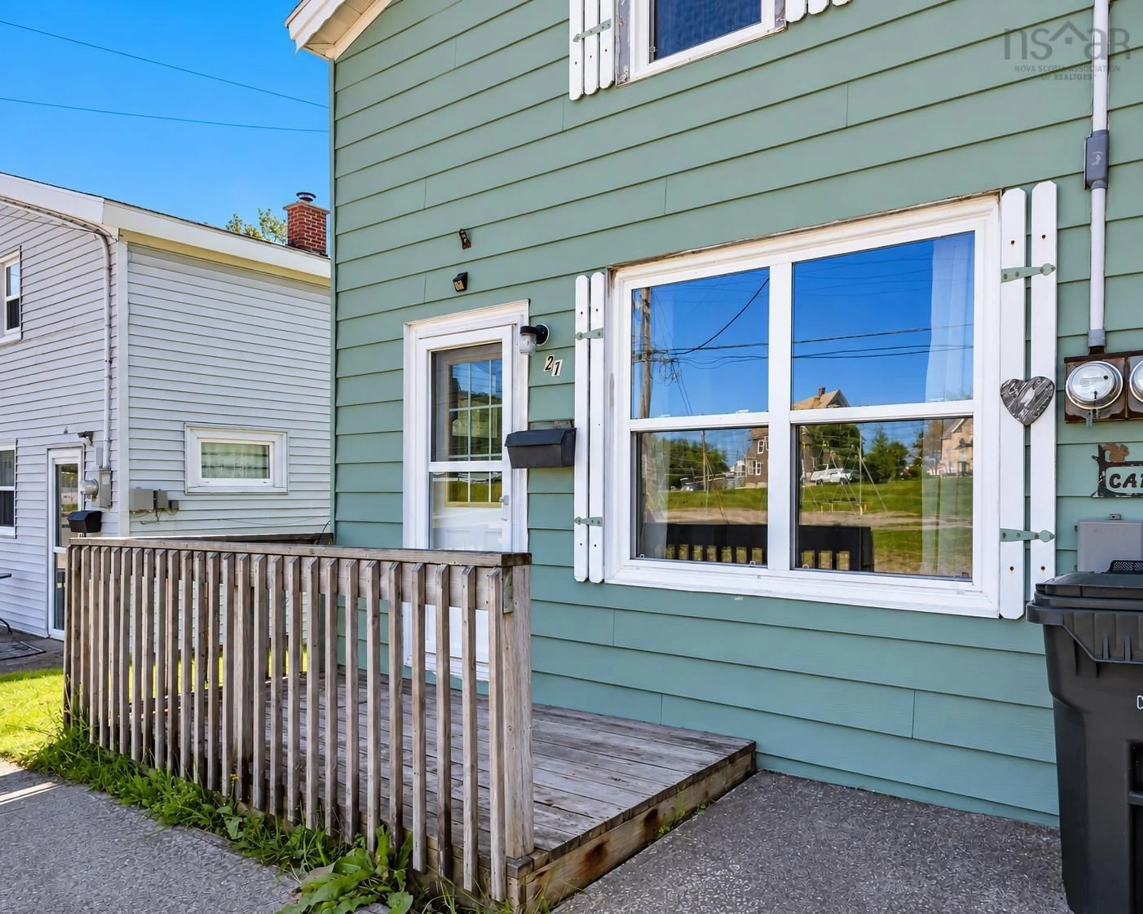 Home with vinyl exterior material, street for 21 Railroad St, Whitney Pier Nova Scotia B1N 2B3