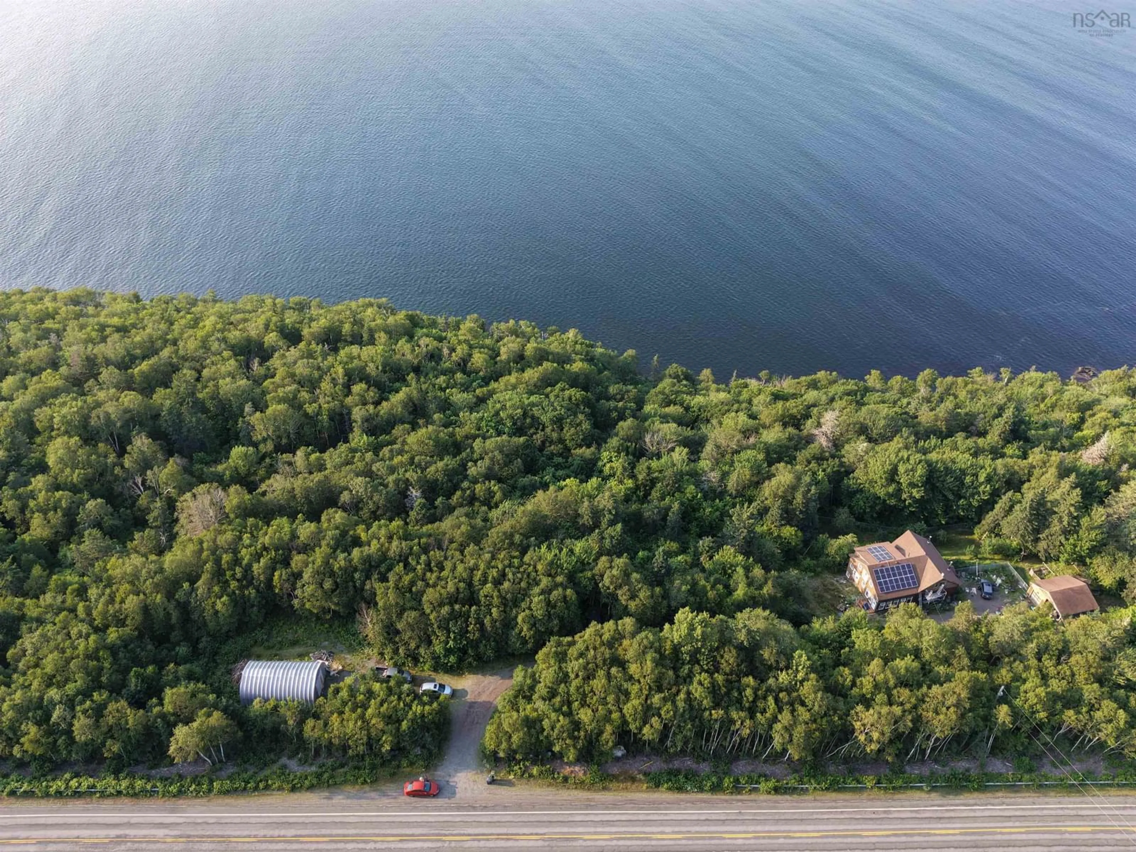 A pic from outside/outdoor area/front of a property/back of a property/a pic from drone, water/lake/river/ocean view for 7980 Highway 16, Halfway Cove Nova Scotia B0H 1N0
