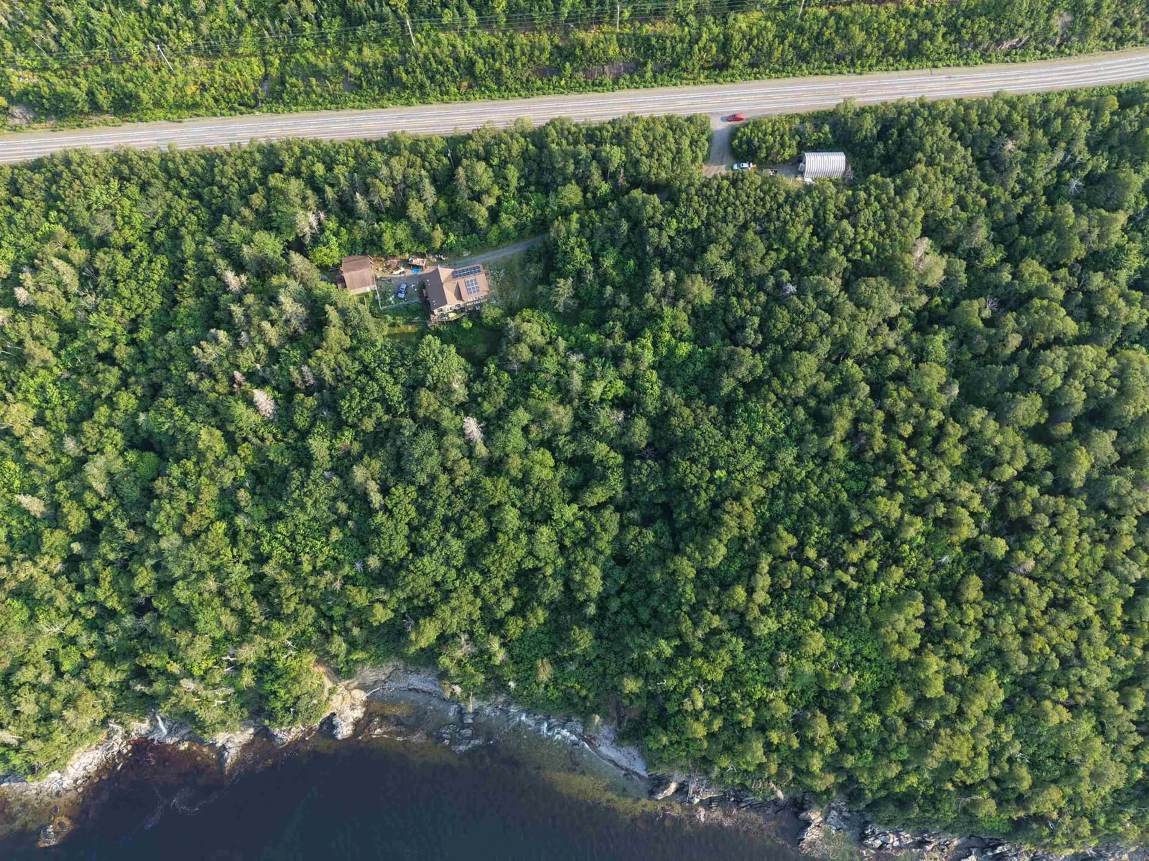 A pic from outside/outdoor area/front of a property/back of a property/a pic from drone, water/lake/river/ocean view for 7980 Highway 16, Halfway Cove Nova Scotia B0H 1N0