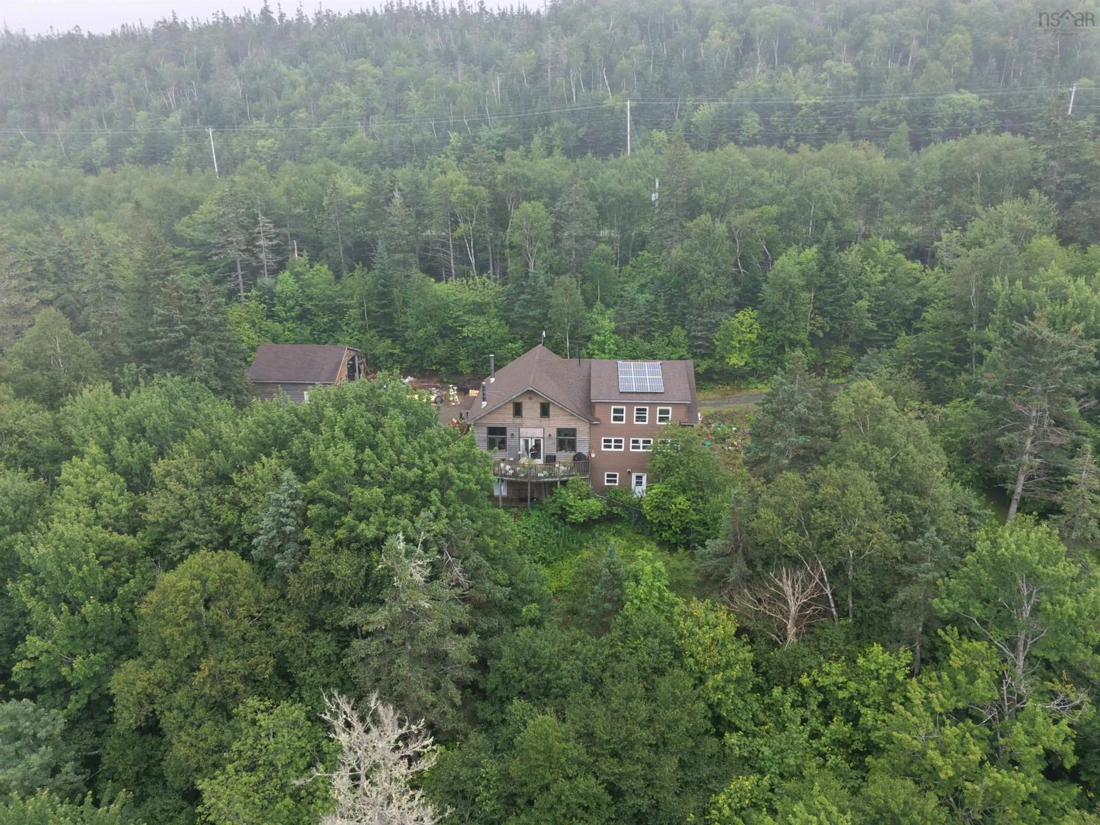A pic from outside/outdoor area/front of a property/back of a property/a pic from drone, forest/trees view for 7980 Highway 16, Halfway Cove Nova Scotia B0H 1N0