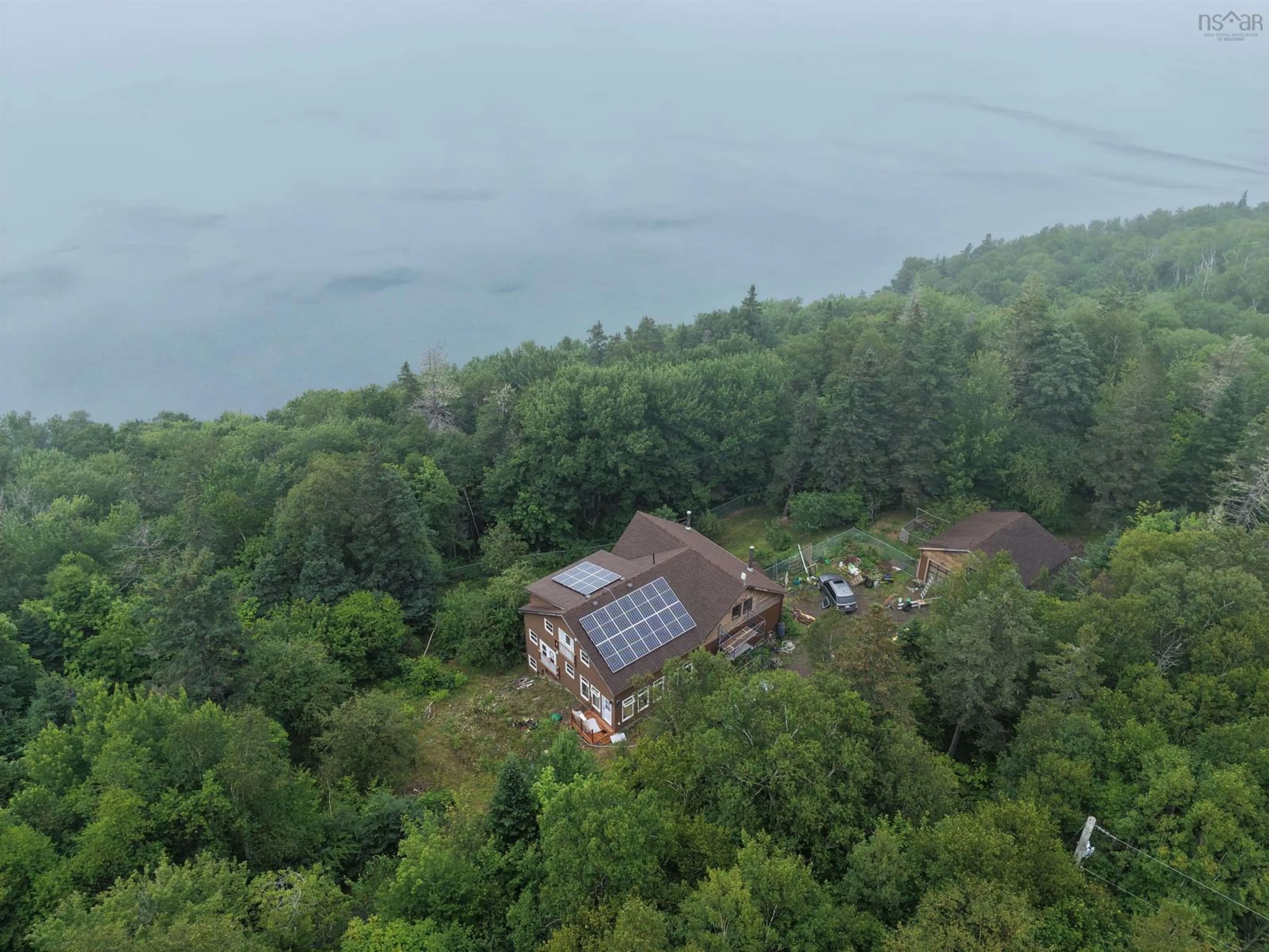 A pic from outside/outdoor area/front of a property/back of a property/a pic from drone, water/lake/river/ocean view for 7980 Highway 16, Halfway Cove Nova Scotia B0H 1N0