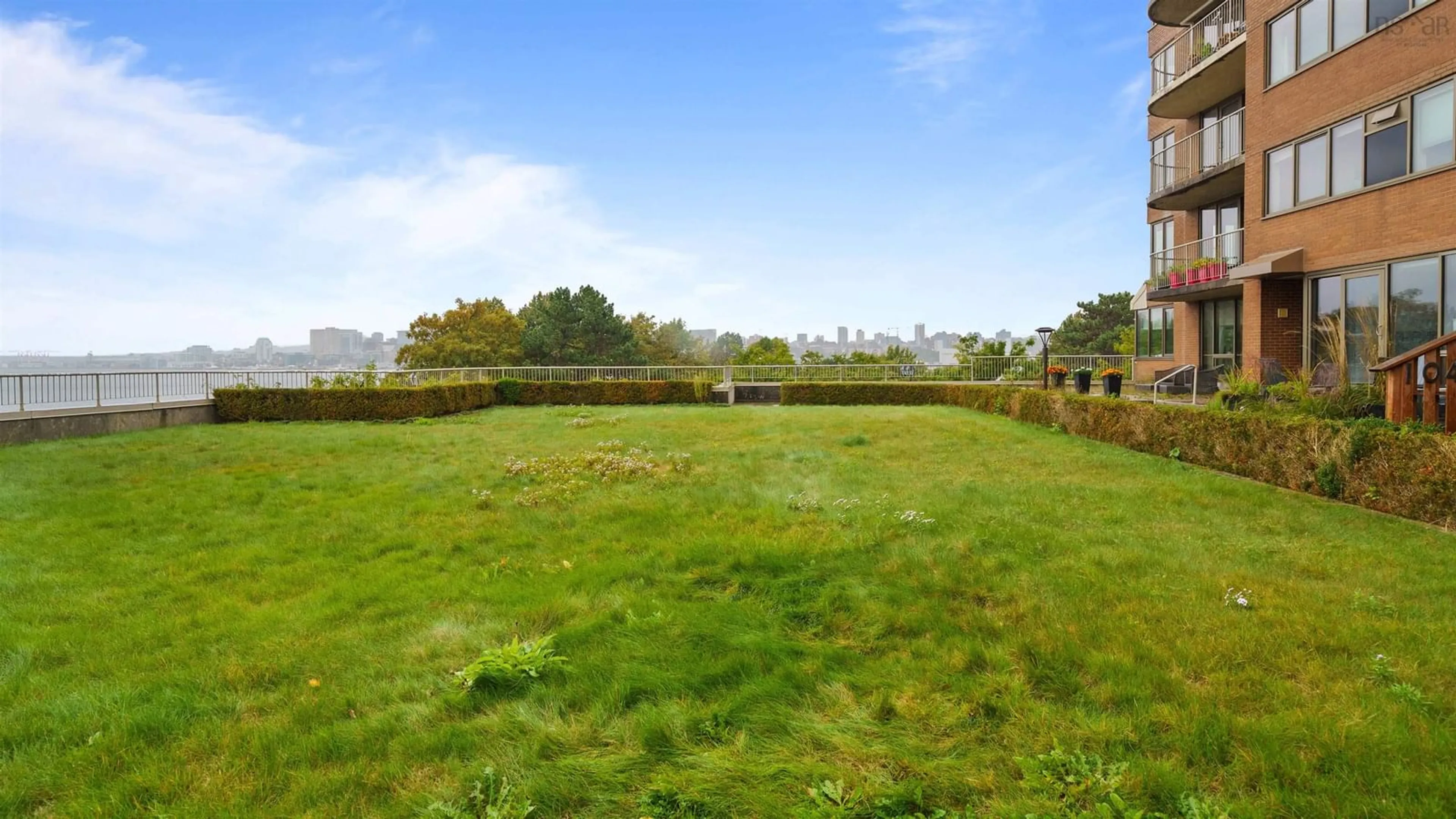 A pic from outside/outdoor area/front of a property/back of a property/a pic from drone, forest/trees view for 1 Prince St #101, Dartmouth Nova Scotia B2Y 4L3