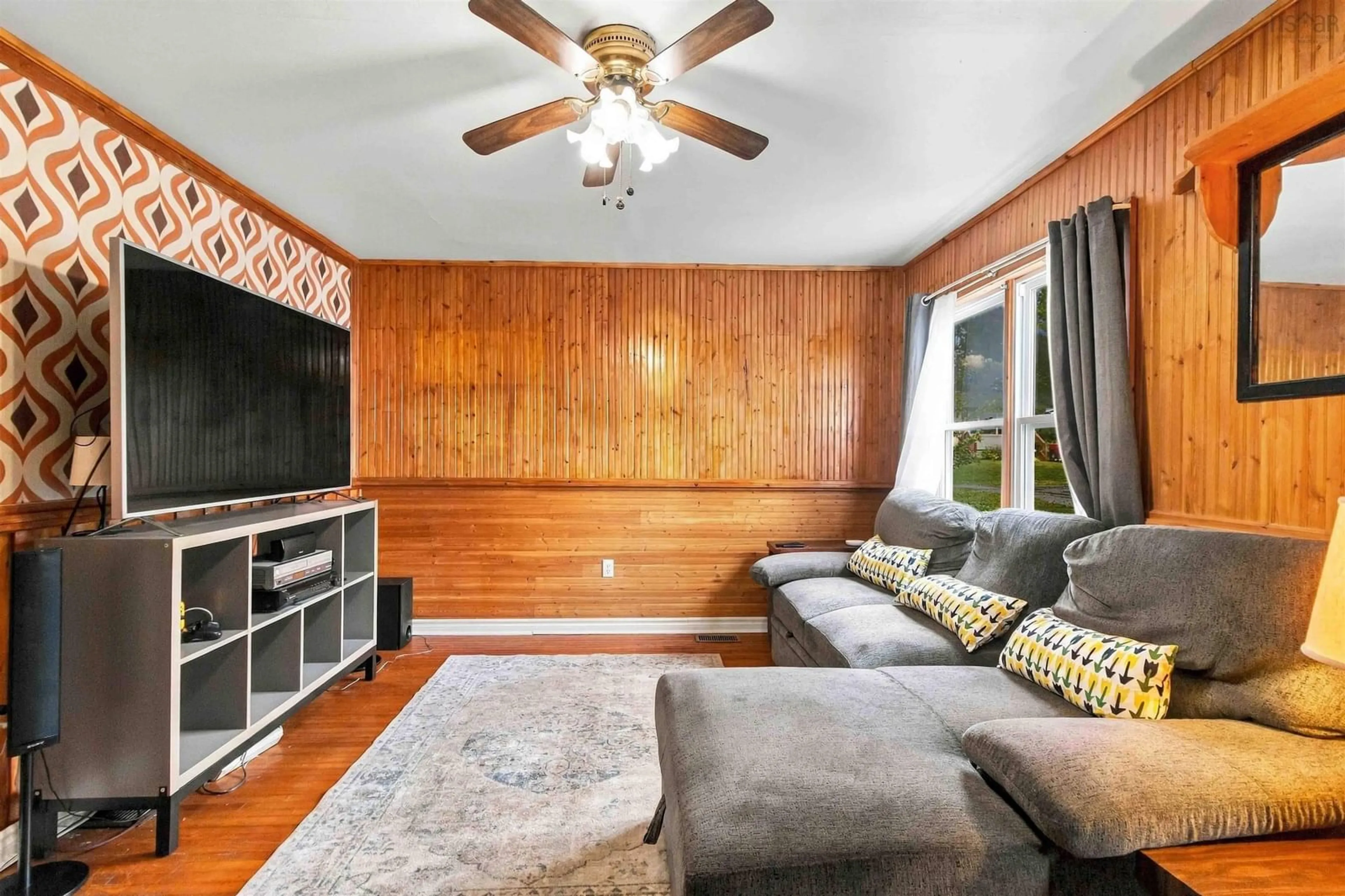 Living room with furniture, wood/laminate floor for Central Blvd #19, Liverpool Nova Scotia B0T 1K0