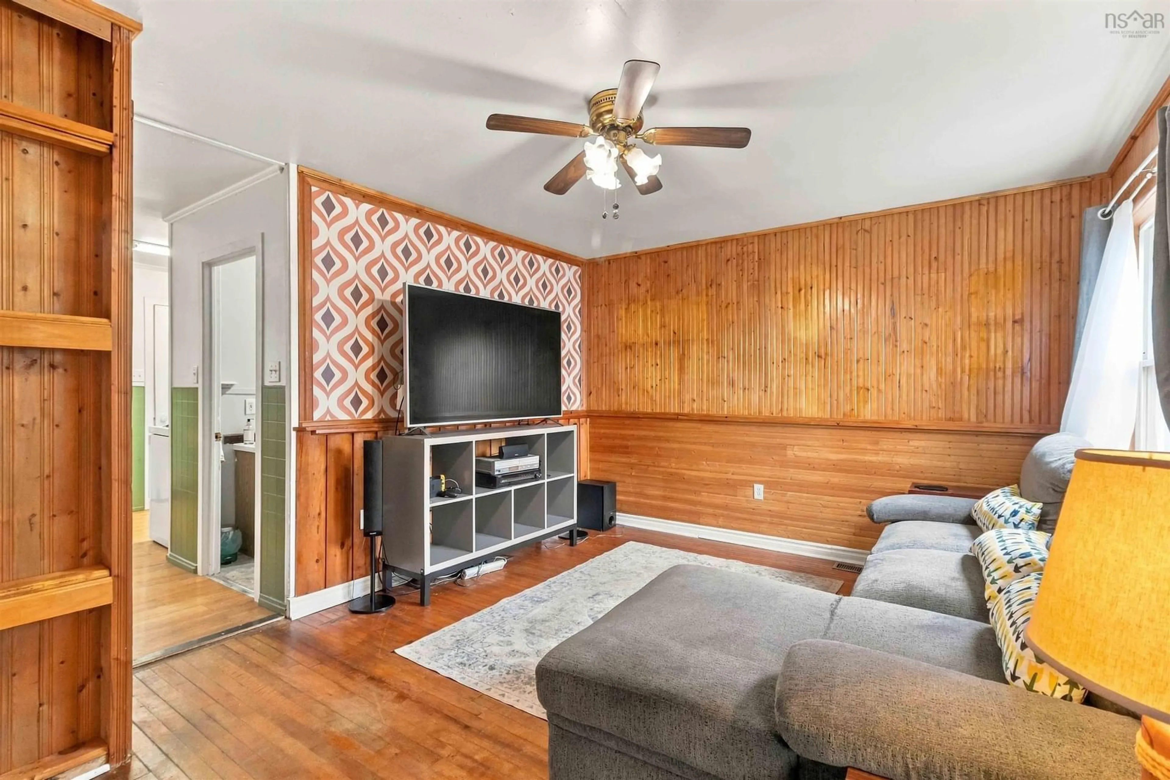 Living room with furniture, wood/laminate floor for Central Blvd #19, Liverpool Nova Scotia B0T 1K0