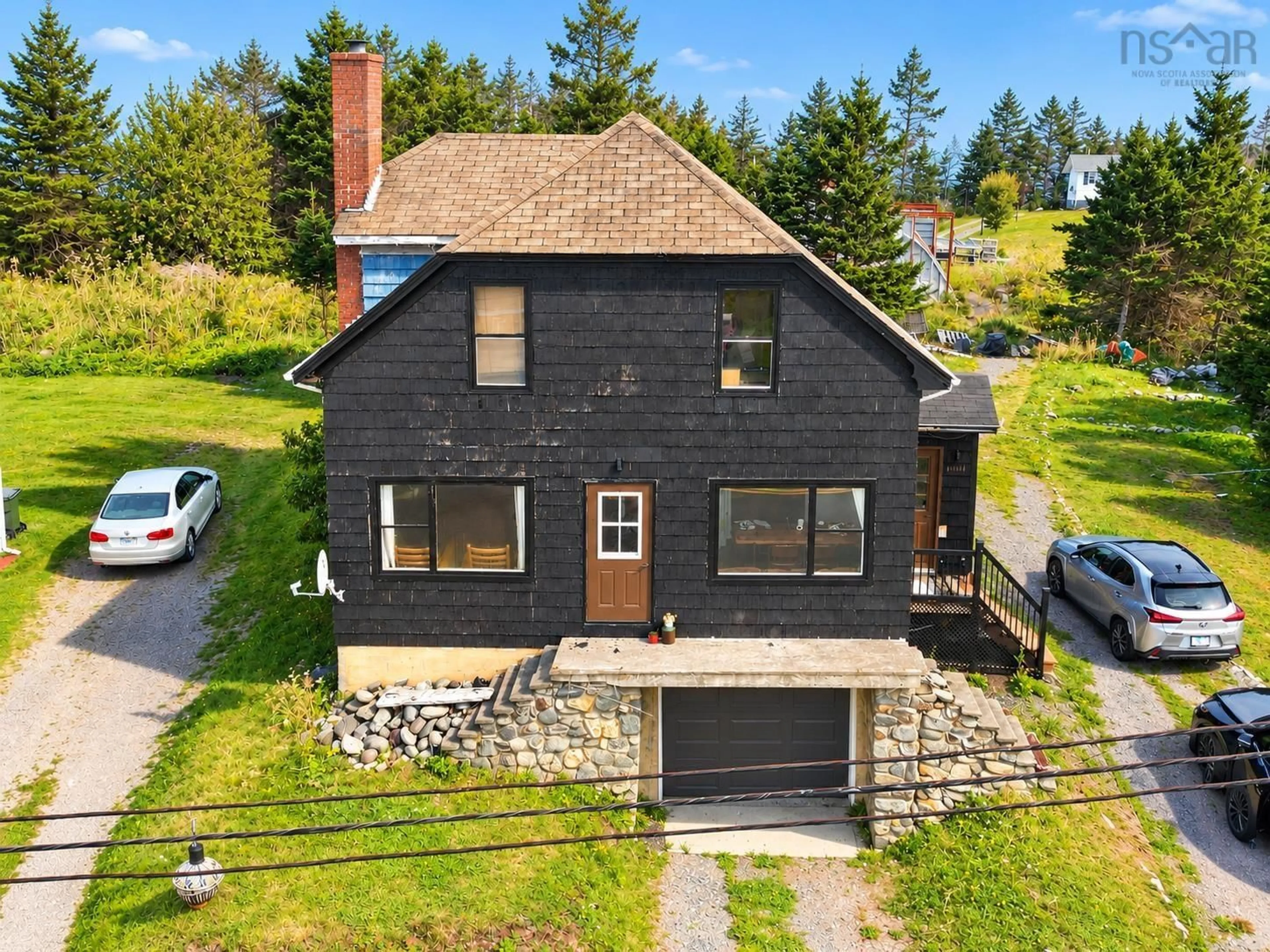 A pic from outside/outdoor area/front of a property/back of a property/a pic from drone, street for 7368 Main St, Louisbourg Nova Scotia B1C 1P5
