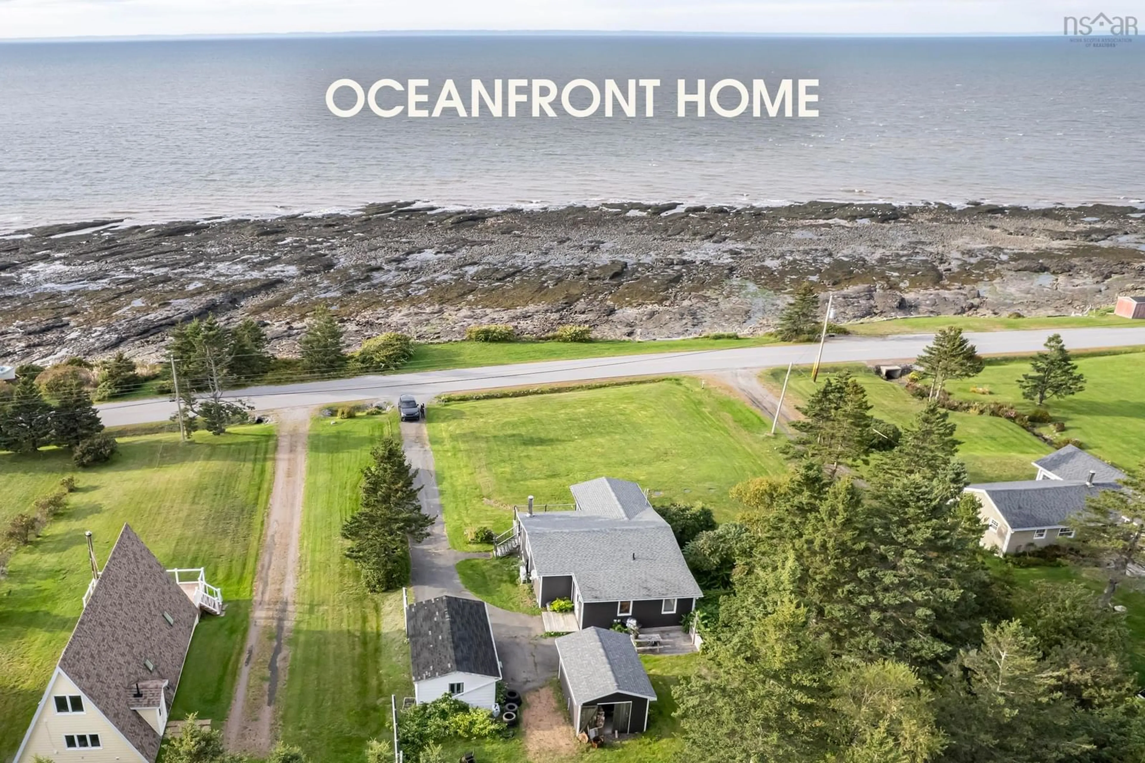 A pic from outside/outdoor area/front of a property/back of a property/a pic from drone, water/lake/river/ocean view for 12240 Shore Rd, Port George Nova Scotia B0S 1P0