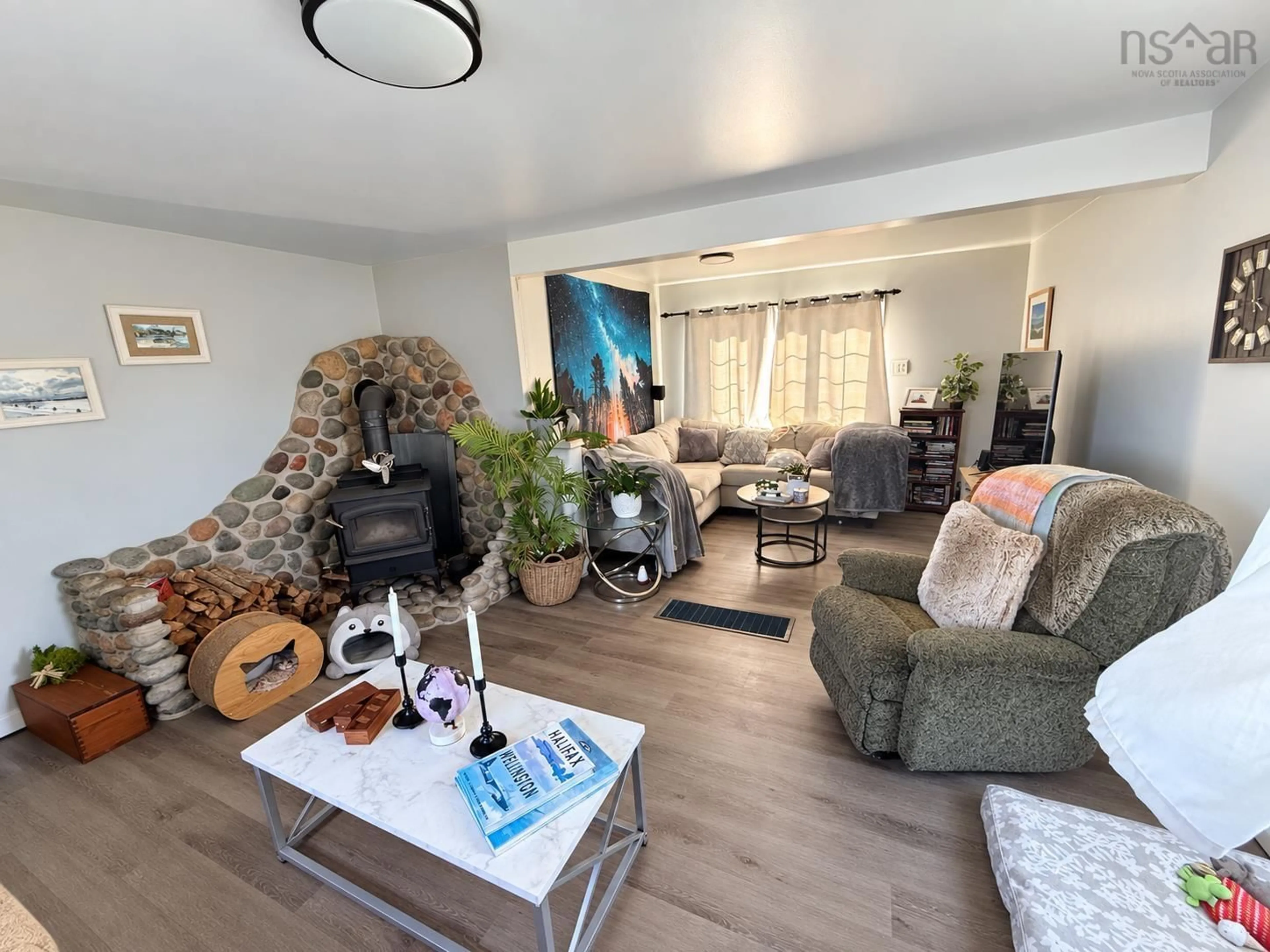 Living room with furniture, wood/laminate floor for 3281 Highway 1, Port Maitland Nova Scotia B5A 5T4
