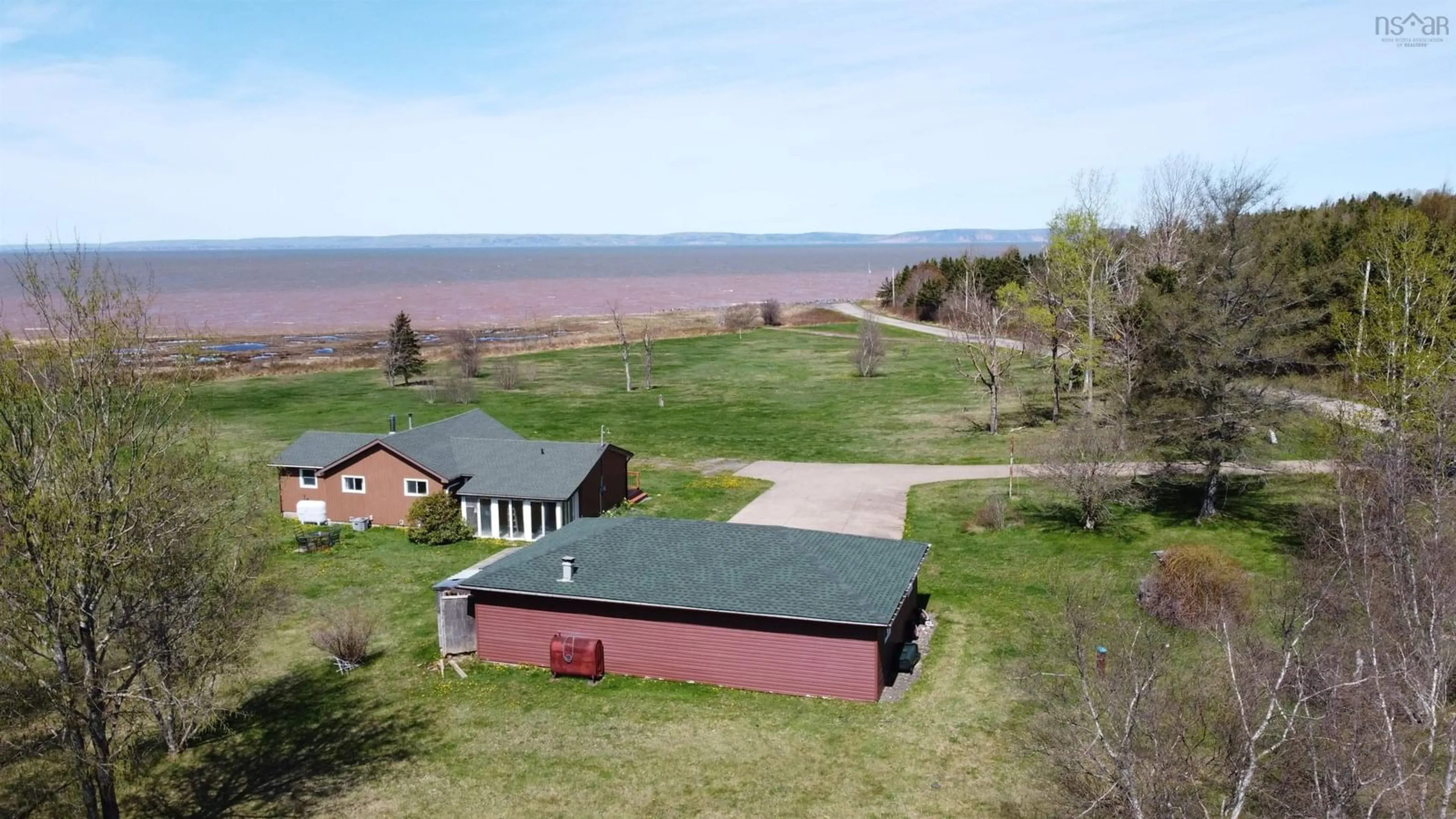 A pic from outside/outdoor area/front of a property/back of a property/a pic from drone, water/lake/river/ocean view for 61 Shipyard Rd, Cheverie Nova Scotia B0N 1G0