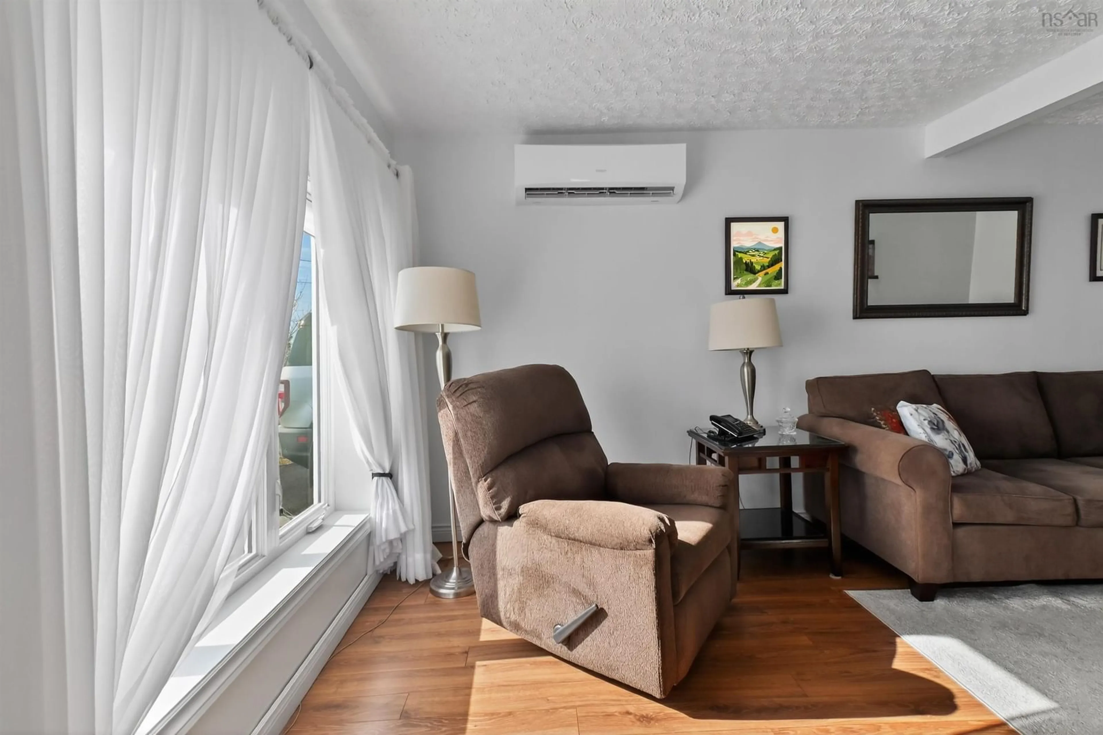 Living room with furniture, wood/laminate floor for 198 Boudreauville Rd, Boudreauville Nova Scotia B0E 2L0