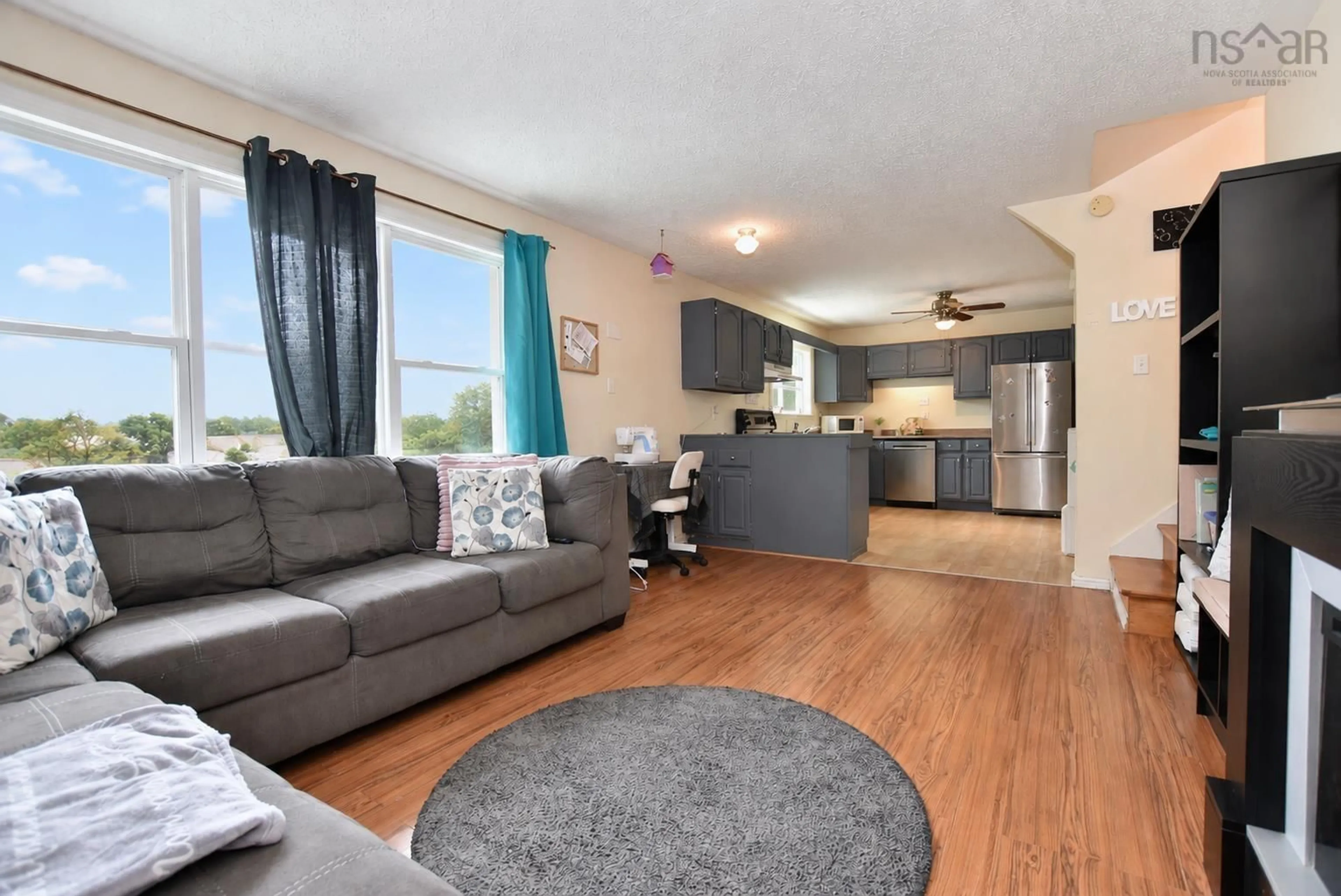 Living room with furniture, wood/laminate floor for 2925 No. 7 Hwy, Lake Echo Nova Scotia B3E 1A4