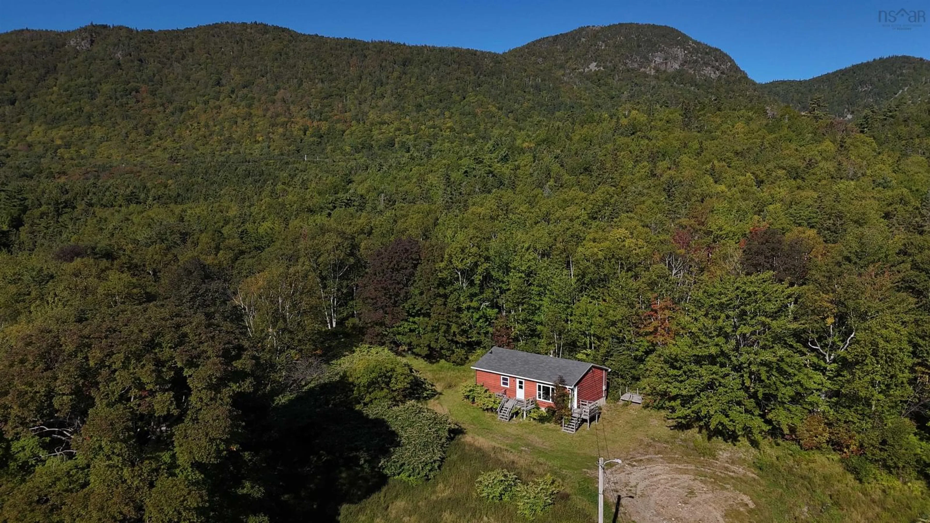 A pic from outside/outdoor area/front of a property/back of a property/a pic from drone, unknown for 101 Millbrook Road, Wreck Cove Nova Scotia B0C 1H0