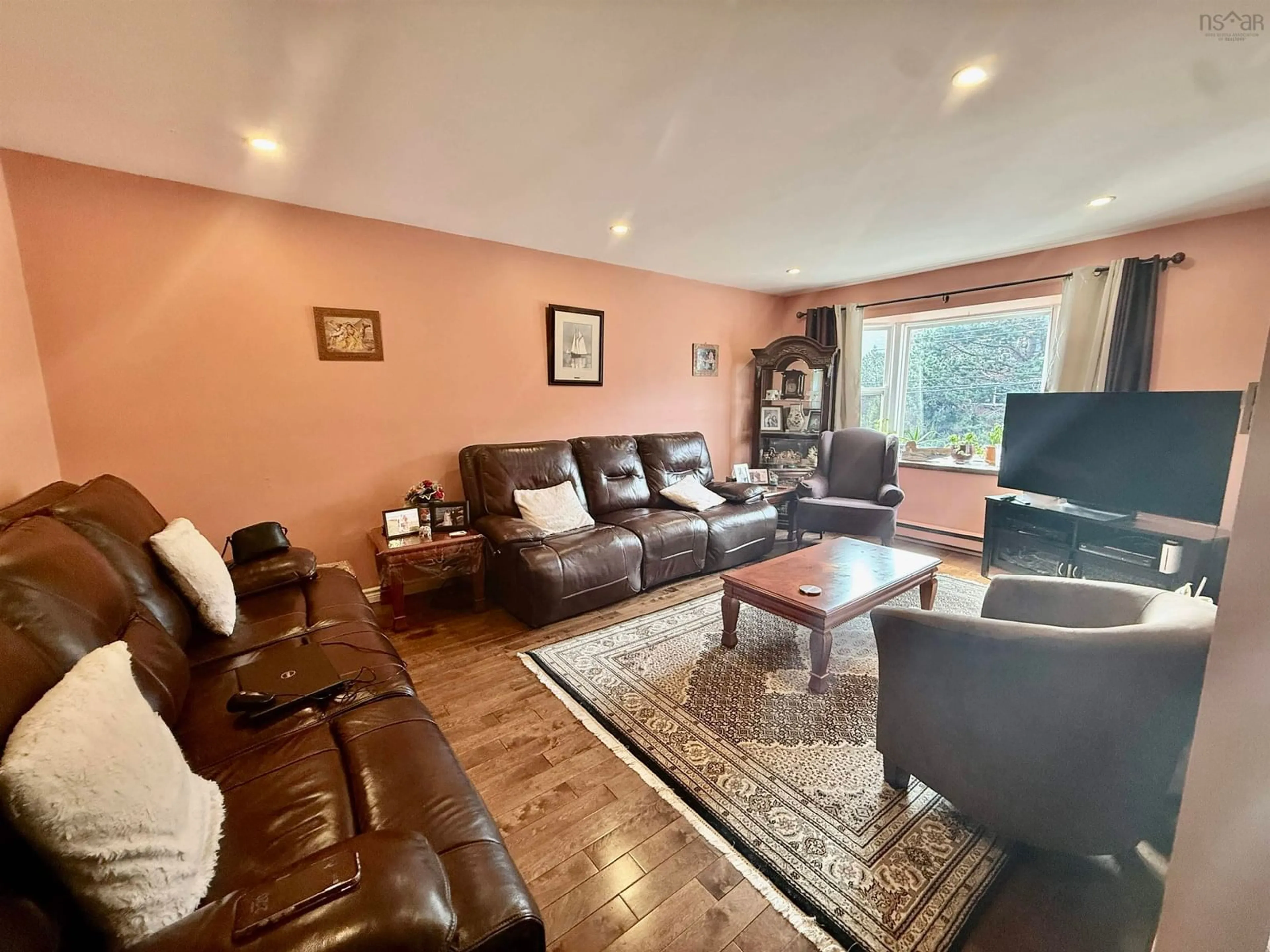 Living room with furniture, wood/laminate floor for 87 Lincoln Cross, Halifax Nova Scotia B3M 3S6