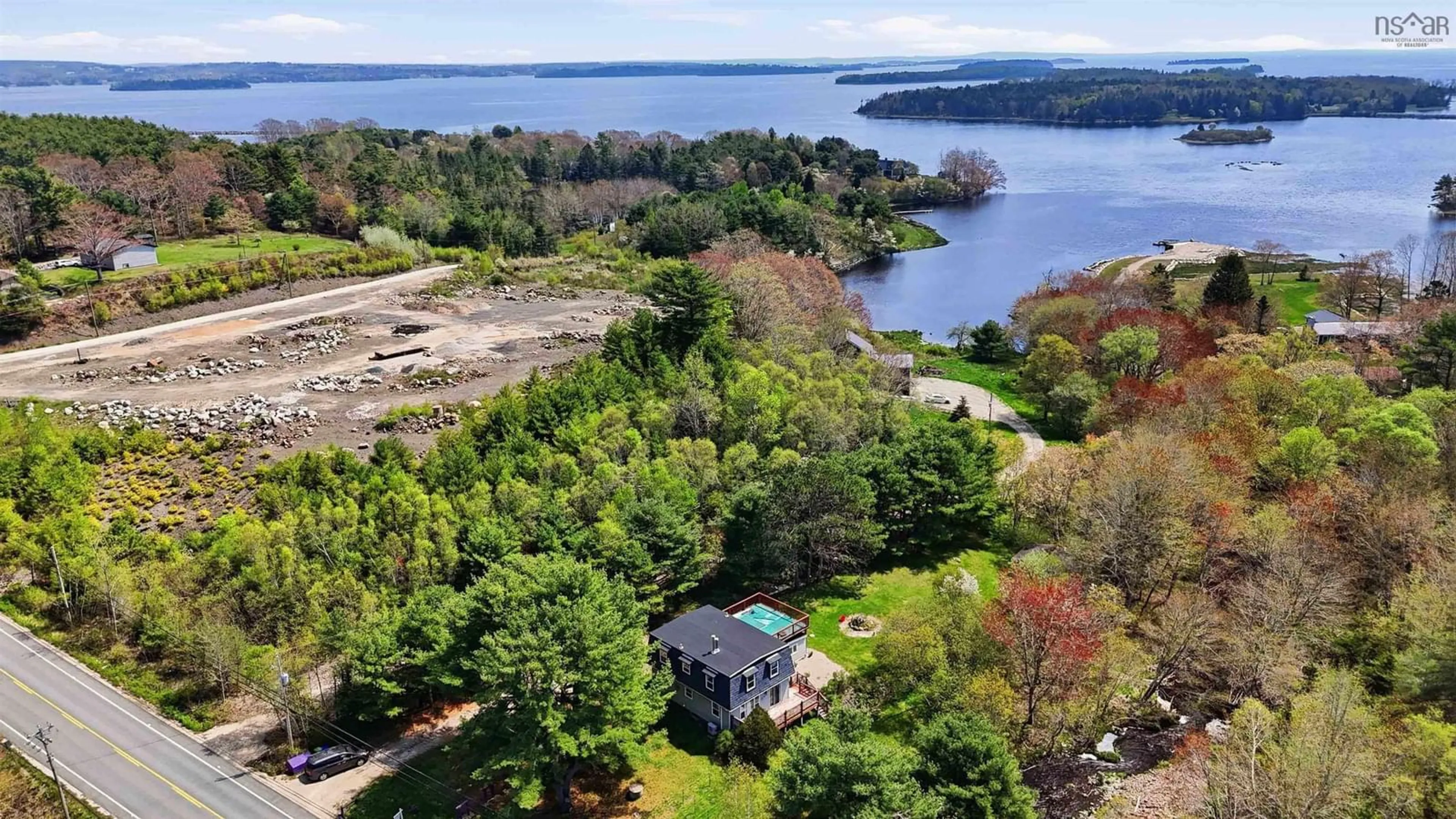 A pic from outside/outdoor area/front of a property/back of a property/a pic from drone, water/lake/river/ocean view for 6689 3 Hwy, Western Shore Nova Scotia B0J 3M0