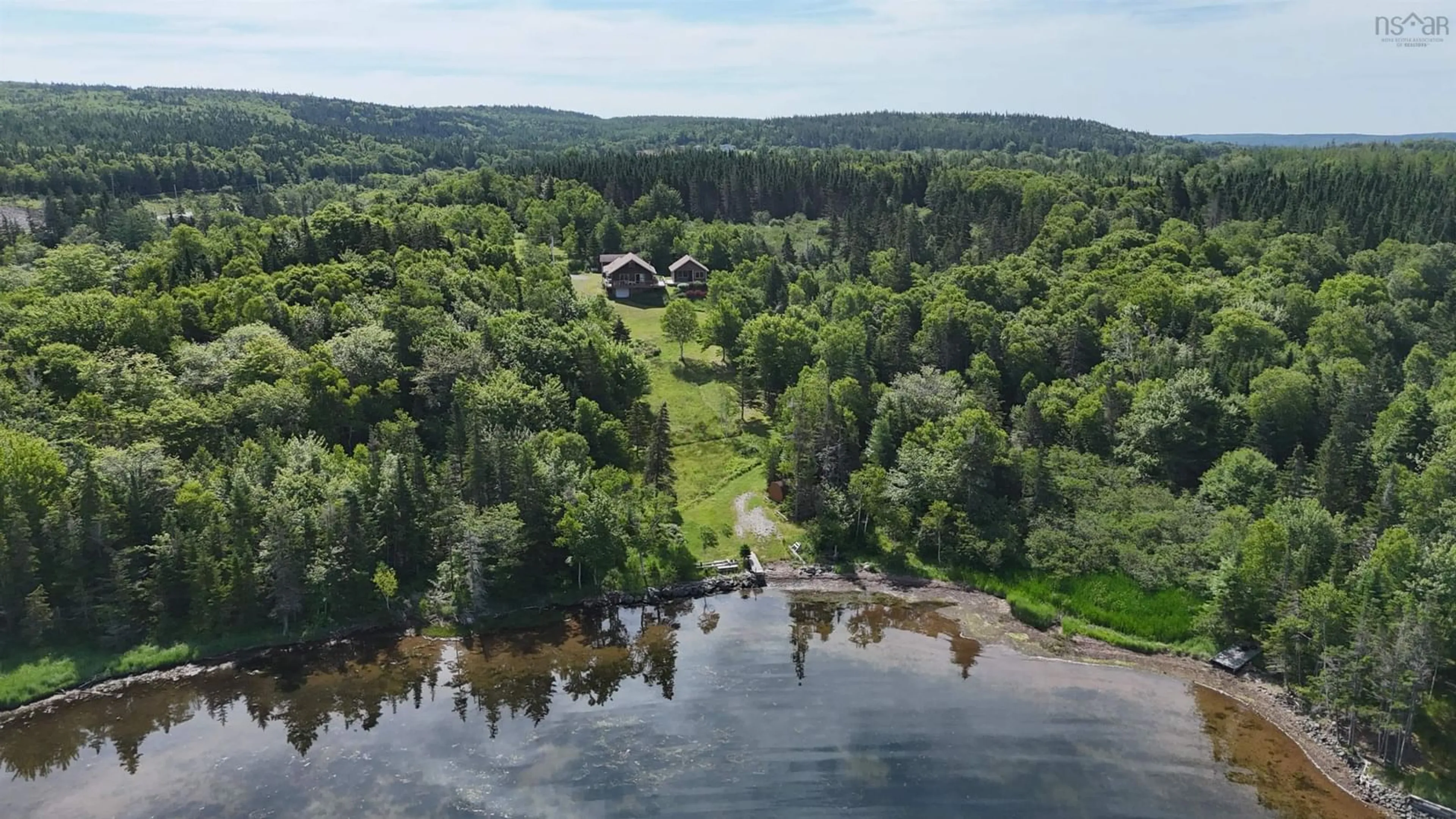 A pic from outside/outdoor area/front of a property/back of a property/a pic from drone, water/lake/river/ocean view for 14515 Highway 4, Hay Cove Nova Scotia B0E 3B0