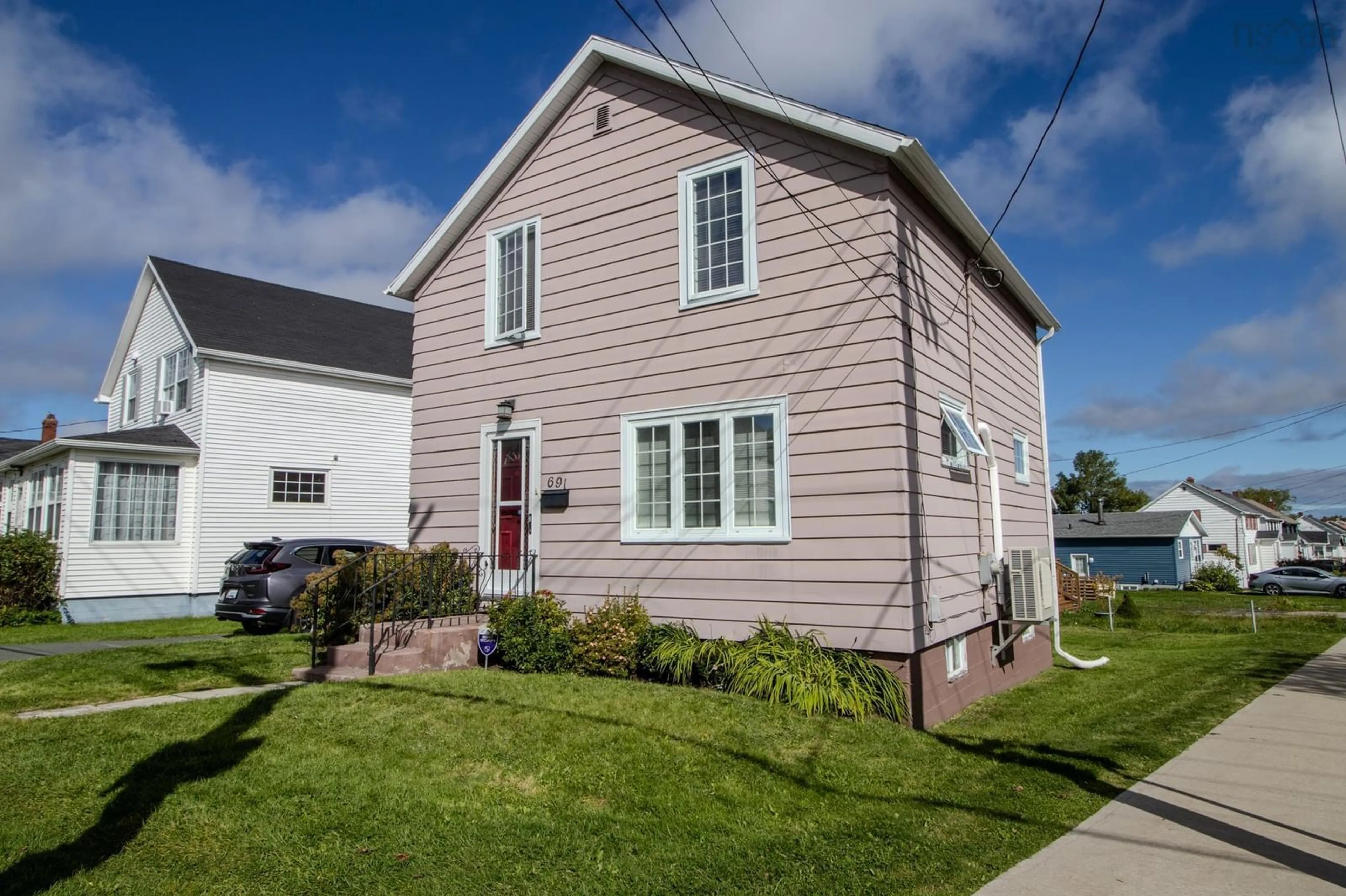 Home with vinyl exterior material, street for 691 Upper Prince St, Sydney Nova Scotia B1P 5N2