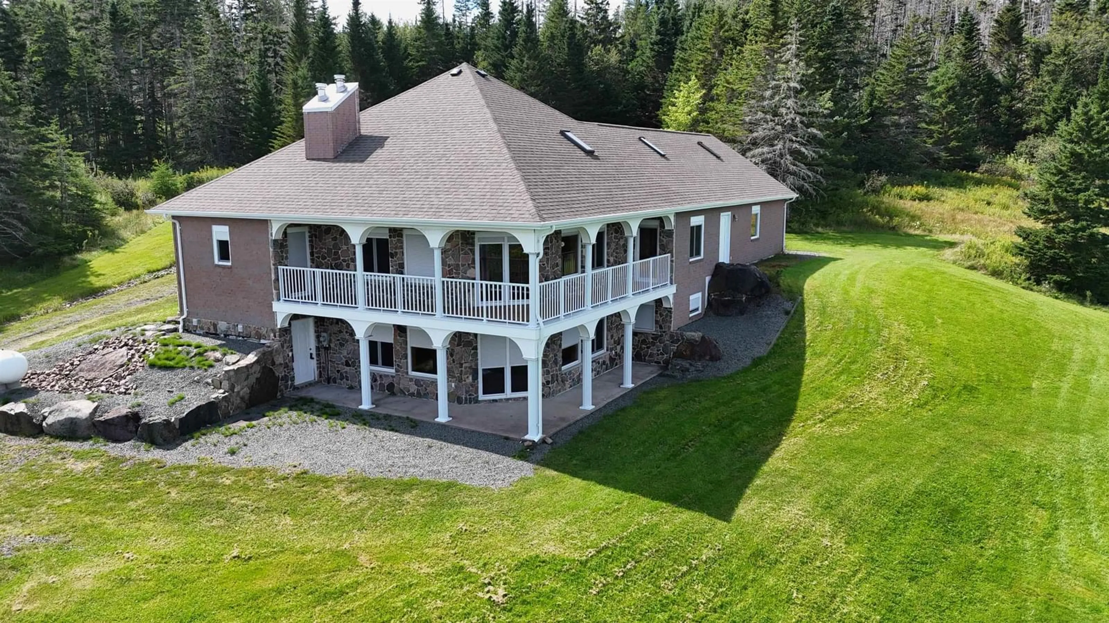A pic from outside/outdoor area/front of a property/back of a property/a pic from drone, mountain view for 6260 West Bay Rd, Roberta Nova Scotia B0E 3K0