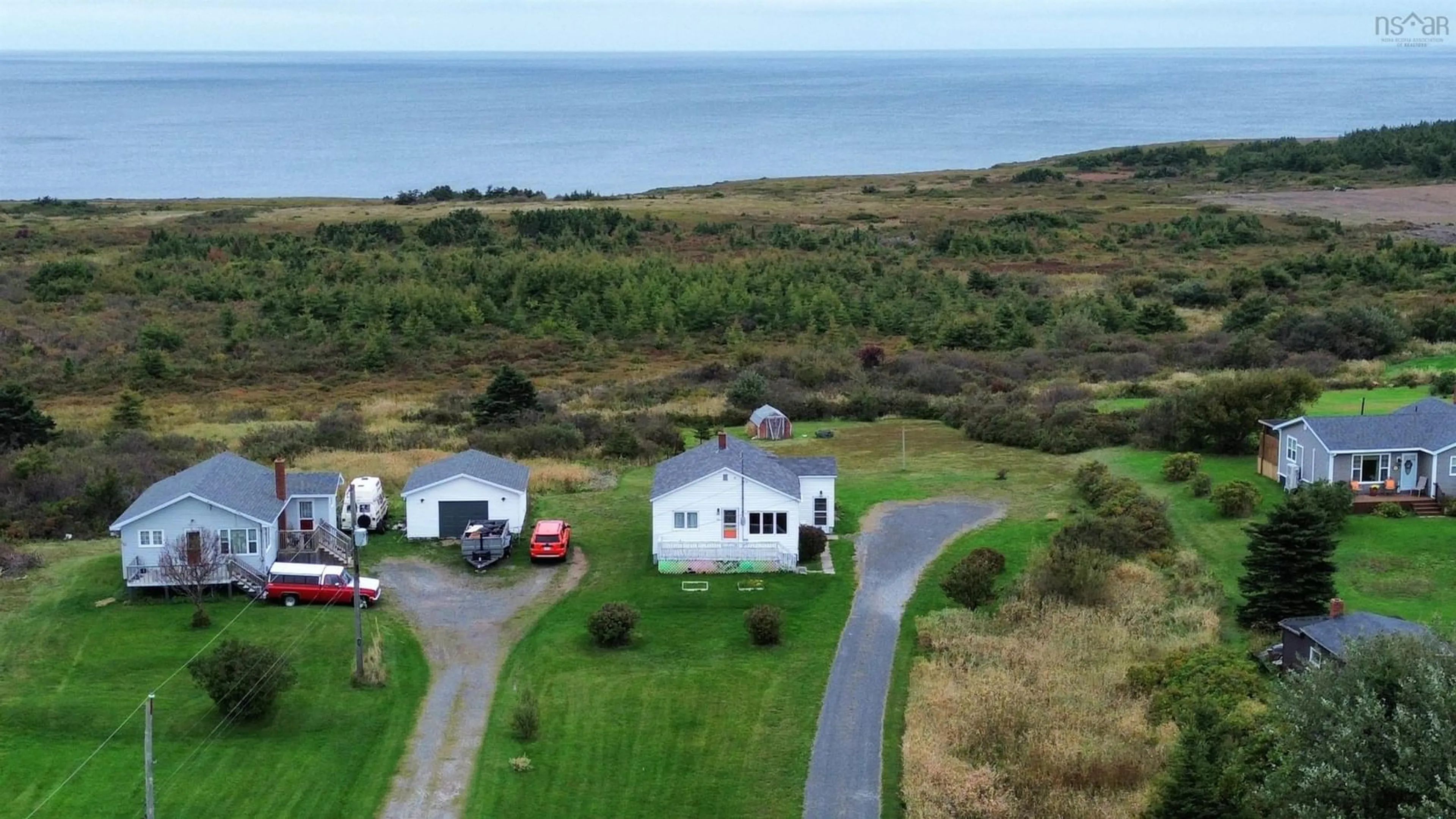 A pic from outside/outdoor area/front of a property/back of a property/a pic from drone, water/lake/river/ocean view for 174 Maclean St, Donkin Nova Scotia B1A 6R3