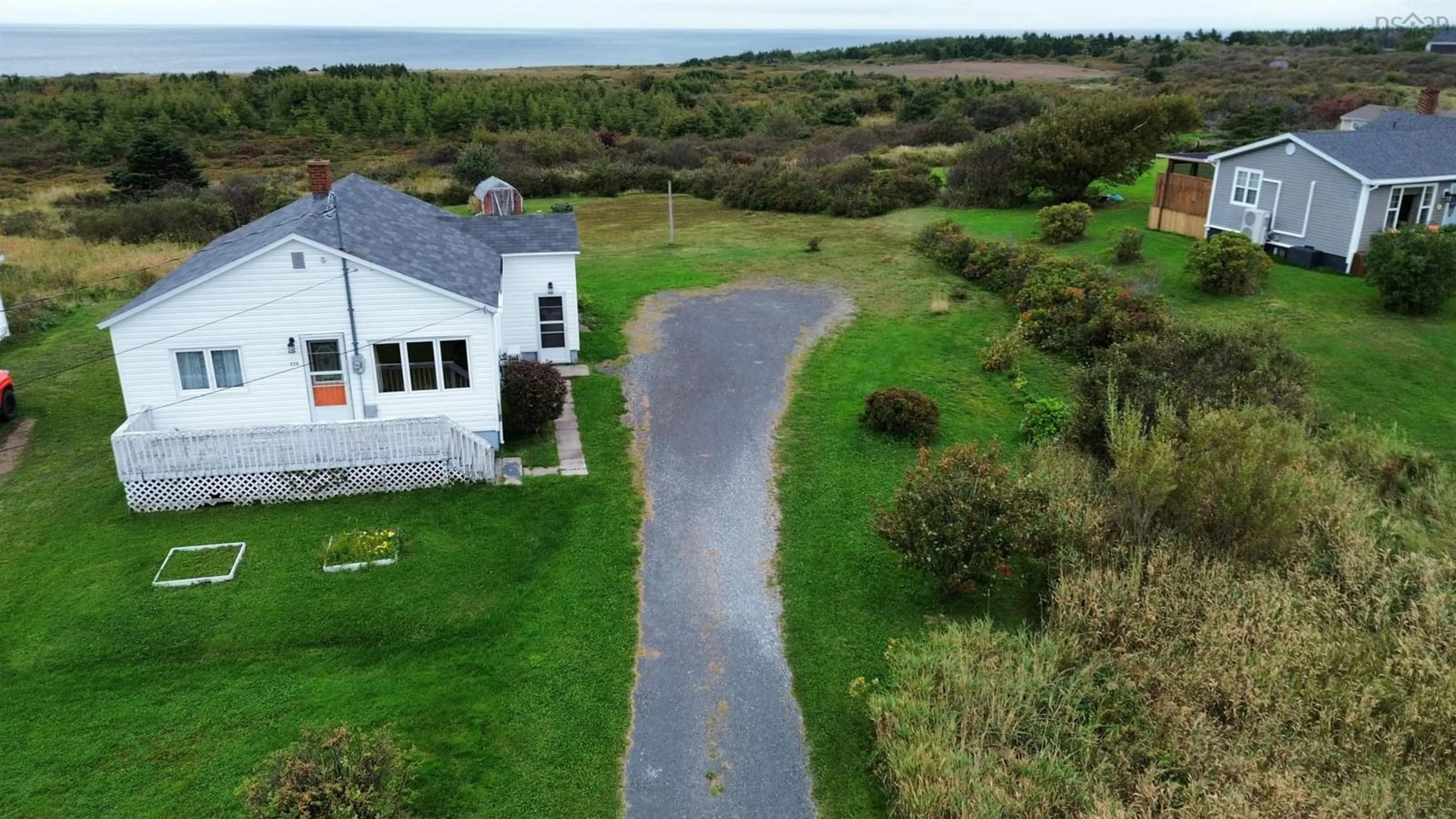 A pic from outside/outdoor area/front of a property/back of a property/a pic from drone, water/lake/river/ocean view for 174 Maclean St, Donkin Nova Scotia B1A 6R3