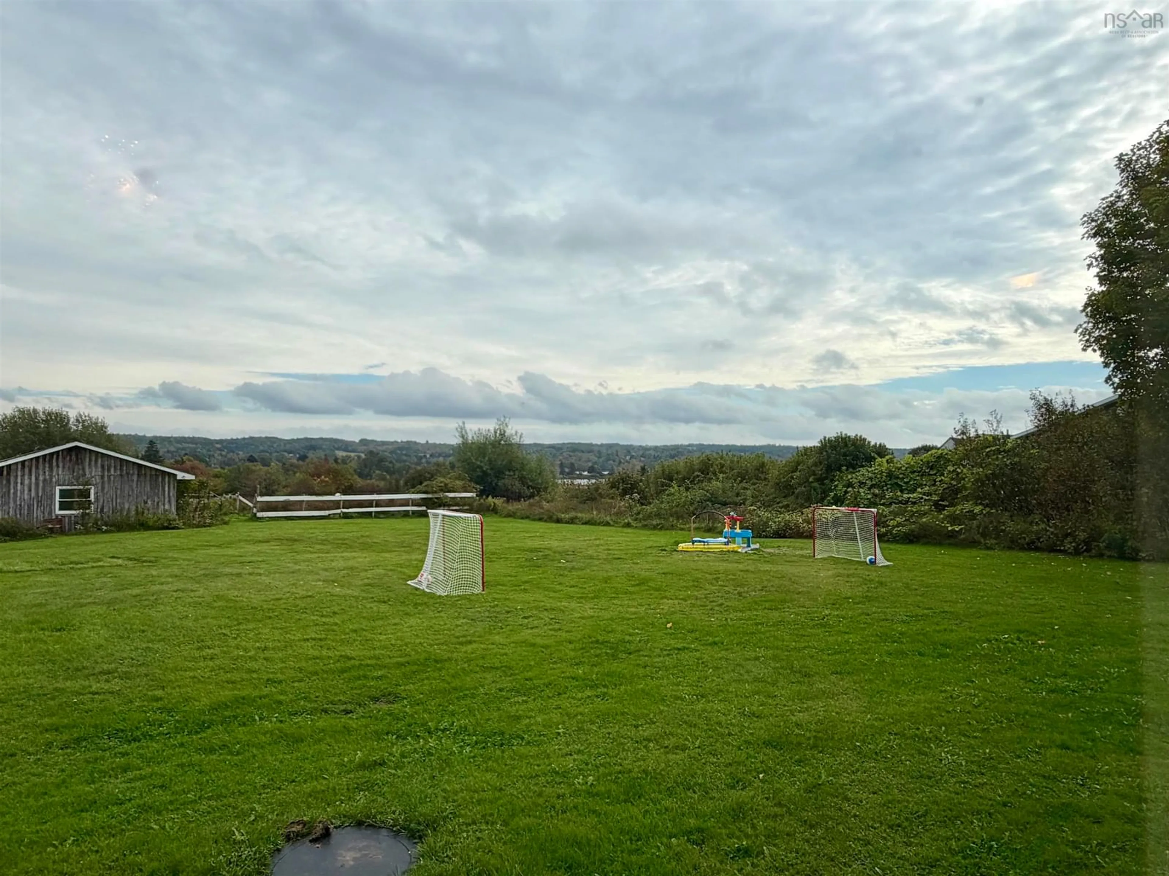 A pic from outside/outdoor area/front of a property/back of a property/a pic from drone, water/lake/river/ocean view for 687 Coxheath Rd, Sydney Nova Scotia B1L 1B5