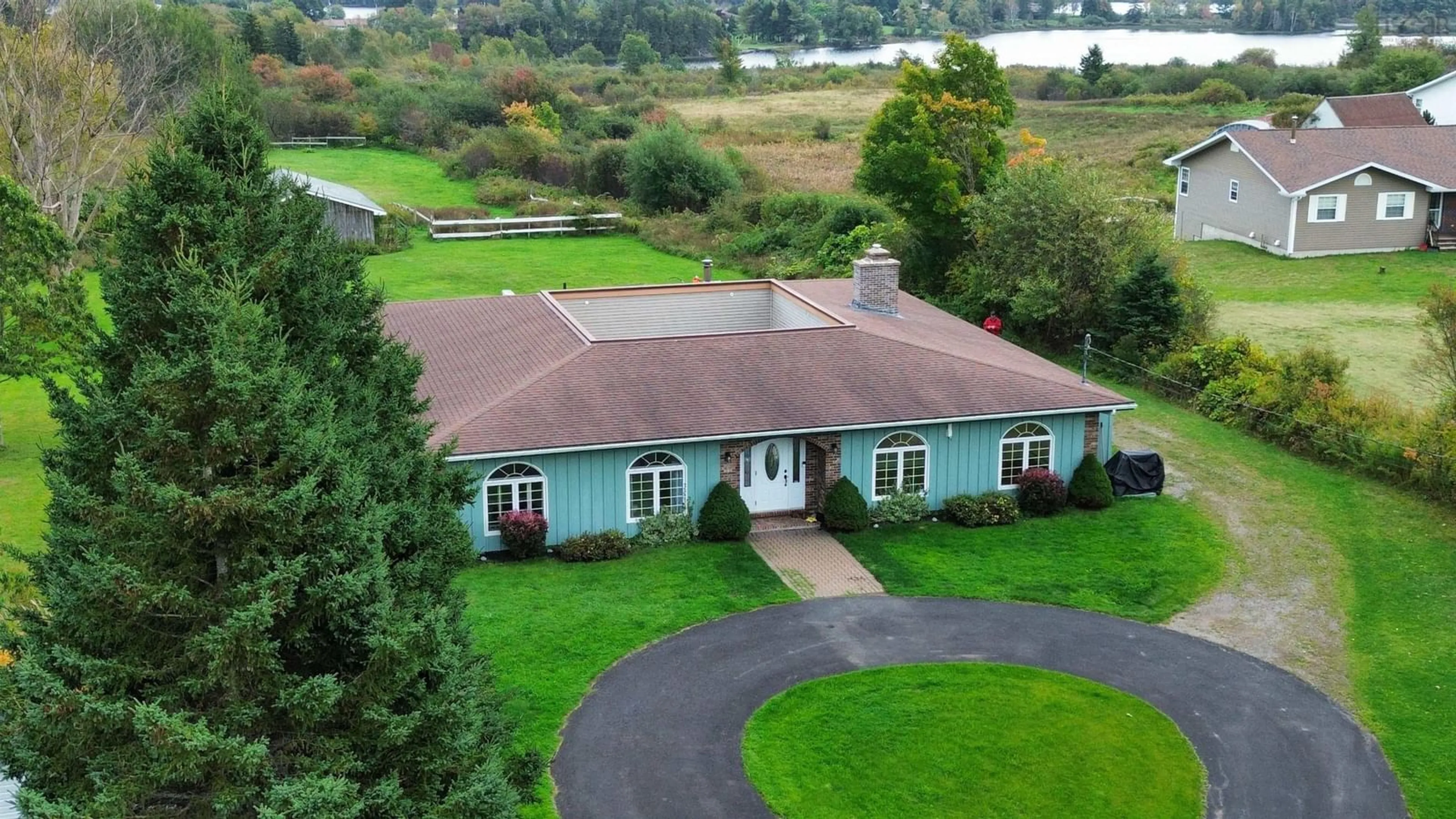 A pic from outside/outdoor area/front of a property/back of a property/a pic from drone, water/lake/river/ocean view for 687 Coxheath Rd, Sydney Nova Scotia B1L 1B5
