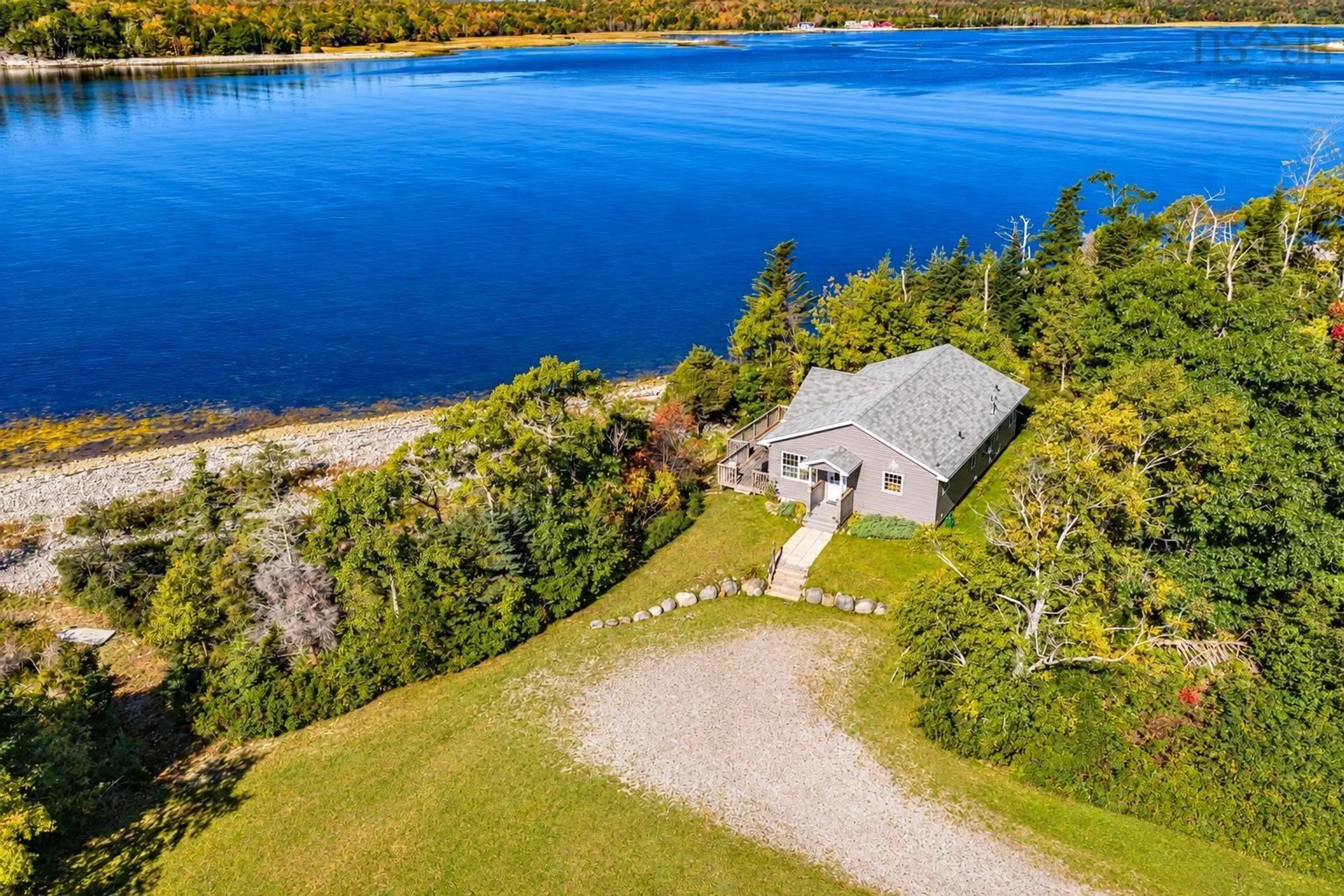 A pic from outside/outdoor area/front of a property/back of a property/a pic from drone, water/lake/river/ocean view for 5763 Highway 3, East Jordan Nova Scotia B0T 1J0