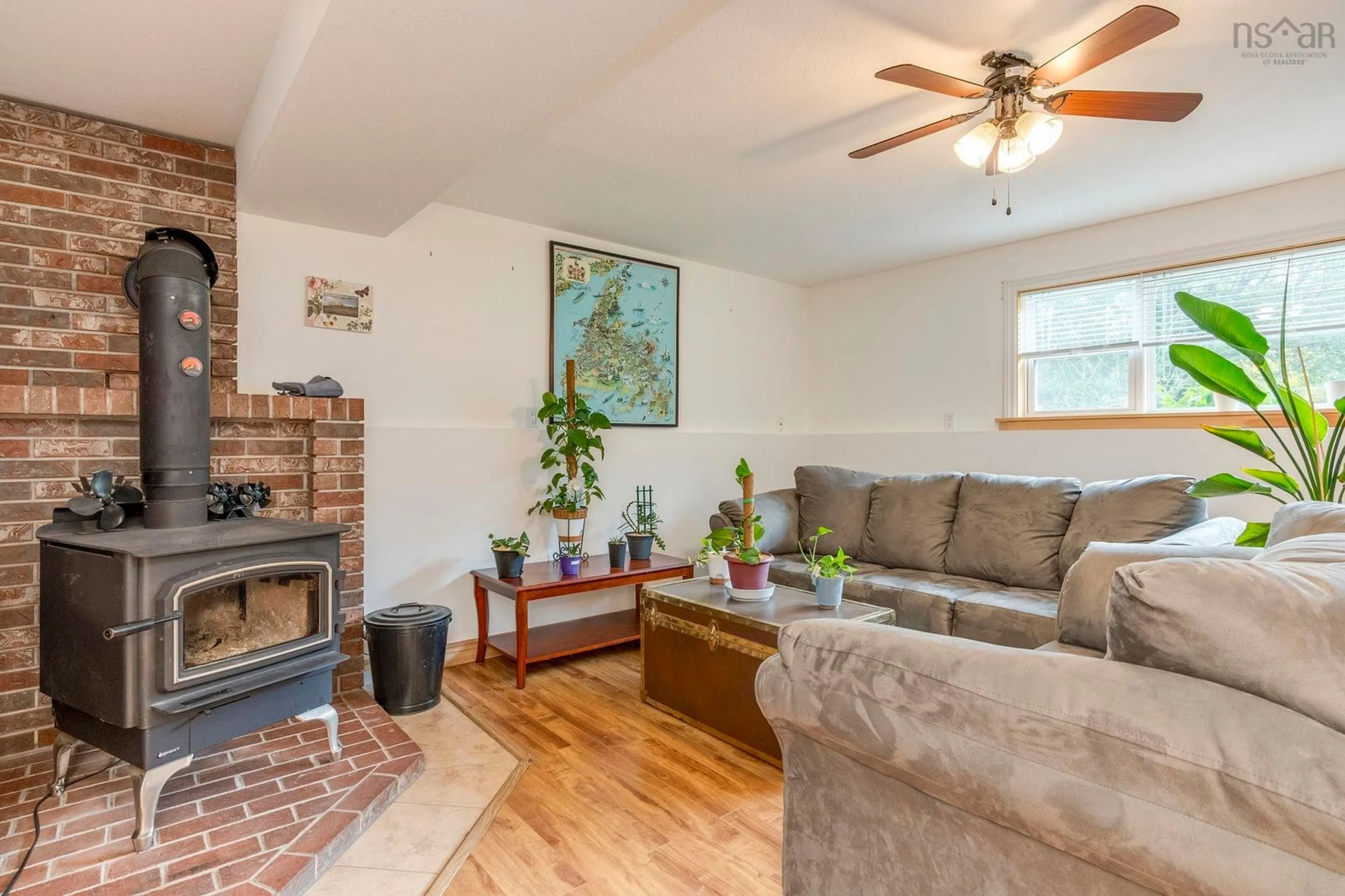 Living room with furniture, wood/laminate floor for 9147 201 Hwy, Nictaux Nova Scotia B0S 1P0