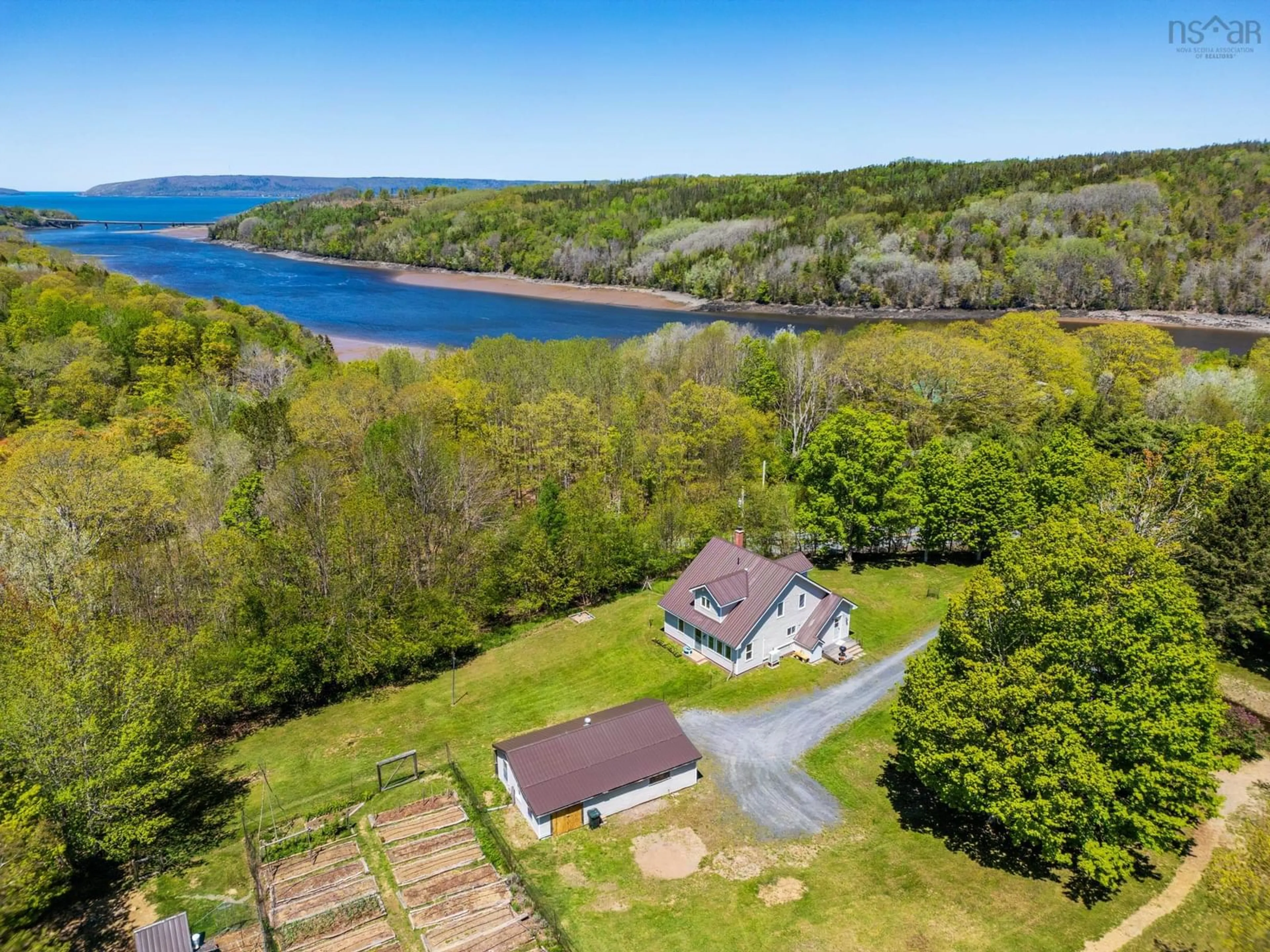 A pic from outside/outdoor area/front of a property/back of a property/a pic from drone, water/lake/river/ocean view for 550 River Rd, Bear River Nova Scotia B0S 1B0