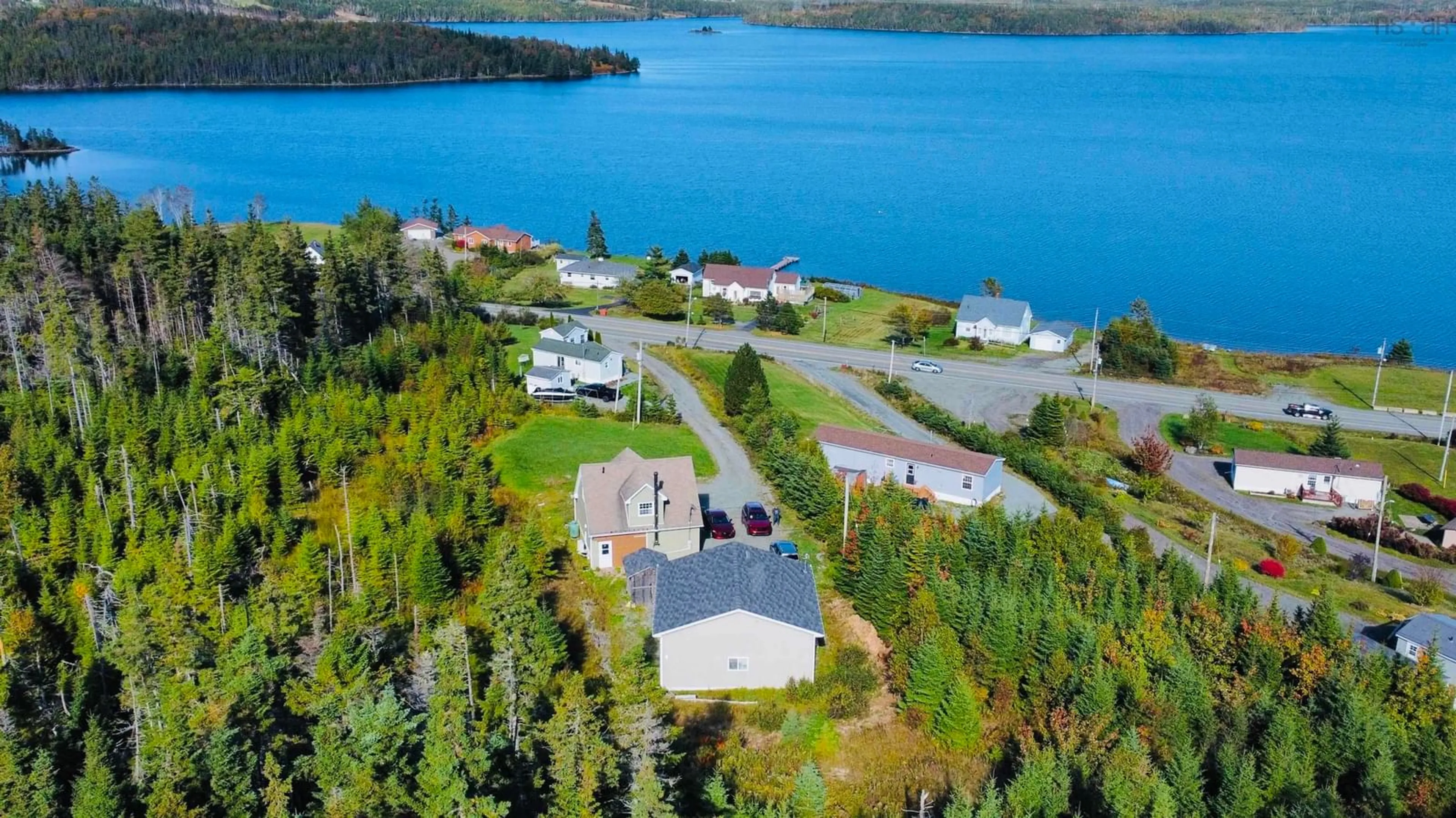 A pic from outside/outdoor area/front of a property/back of a property/a pic from drone, water/lake/river/ocean view for 10198 Grenville St, St. Peter's Nova Scotia B0E 3B0