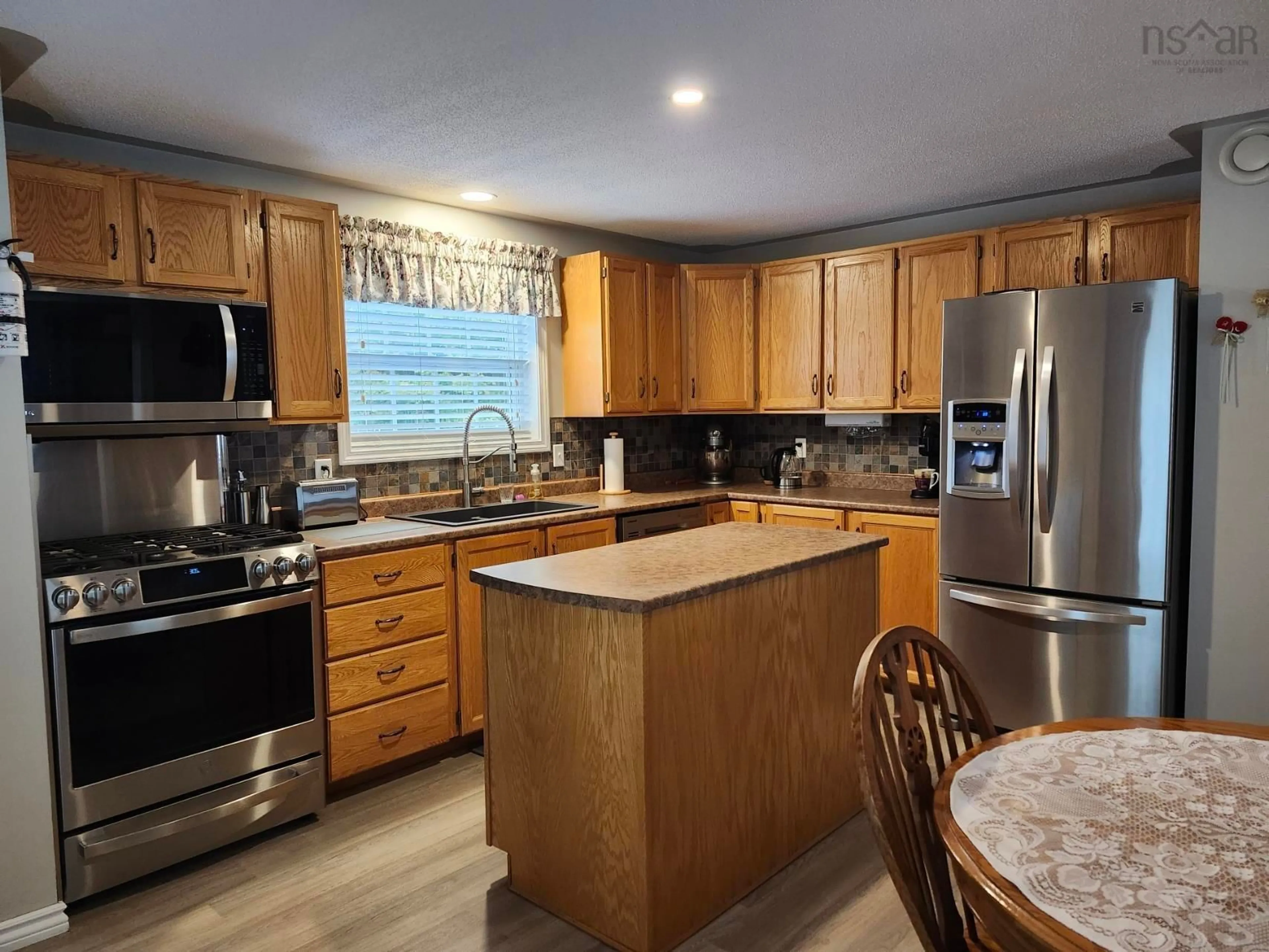 Open concept kitchen, unknown for 49 Meadow Dr, Beaver Bank Nova Scotia B4G 1B5