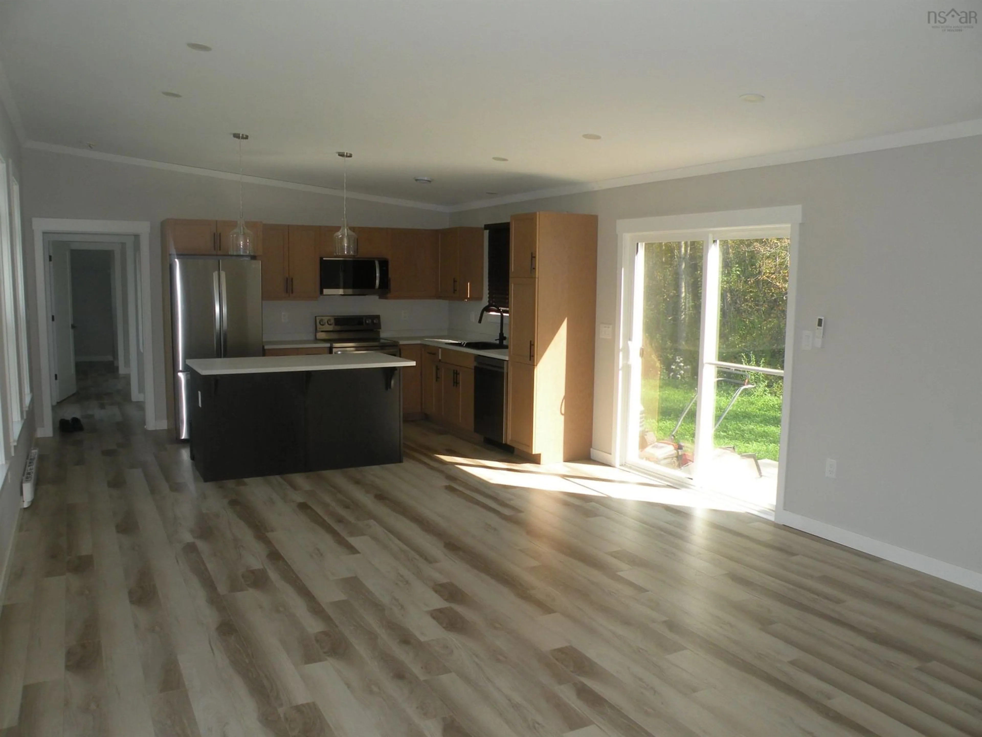 Open concept kitchen, wood/laminate floor for 20665 Highway 2, Shubenacadie Nova Scotia B0N 2H0