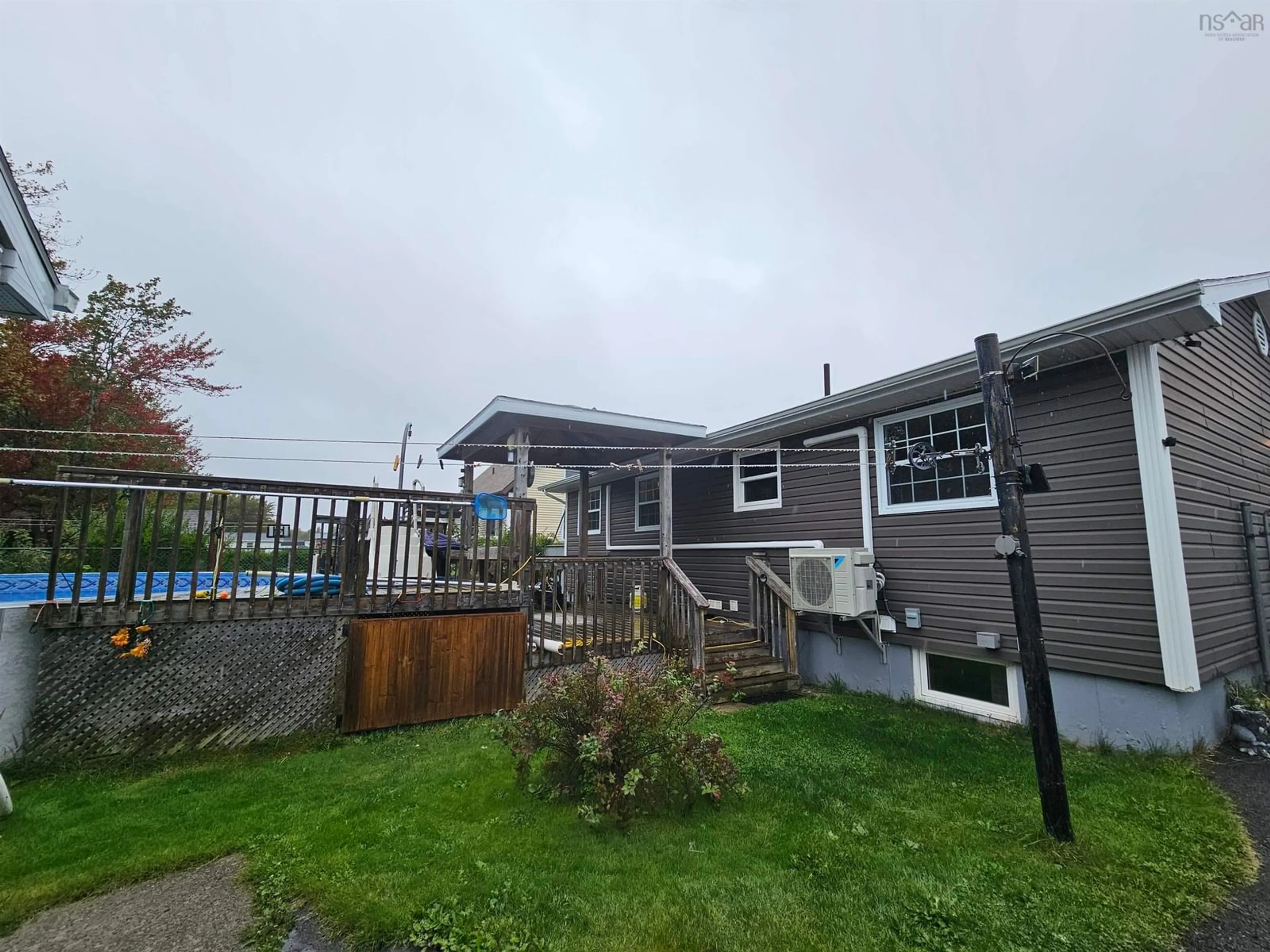 A pic from outside/outdoor area/front of a property/back of a property/a pic from drone, unknown for 8 Stacey Ave, North Sydney Nova Scotia B2A 3P4