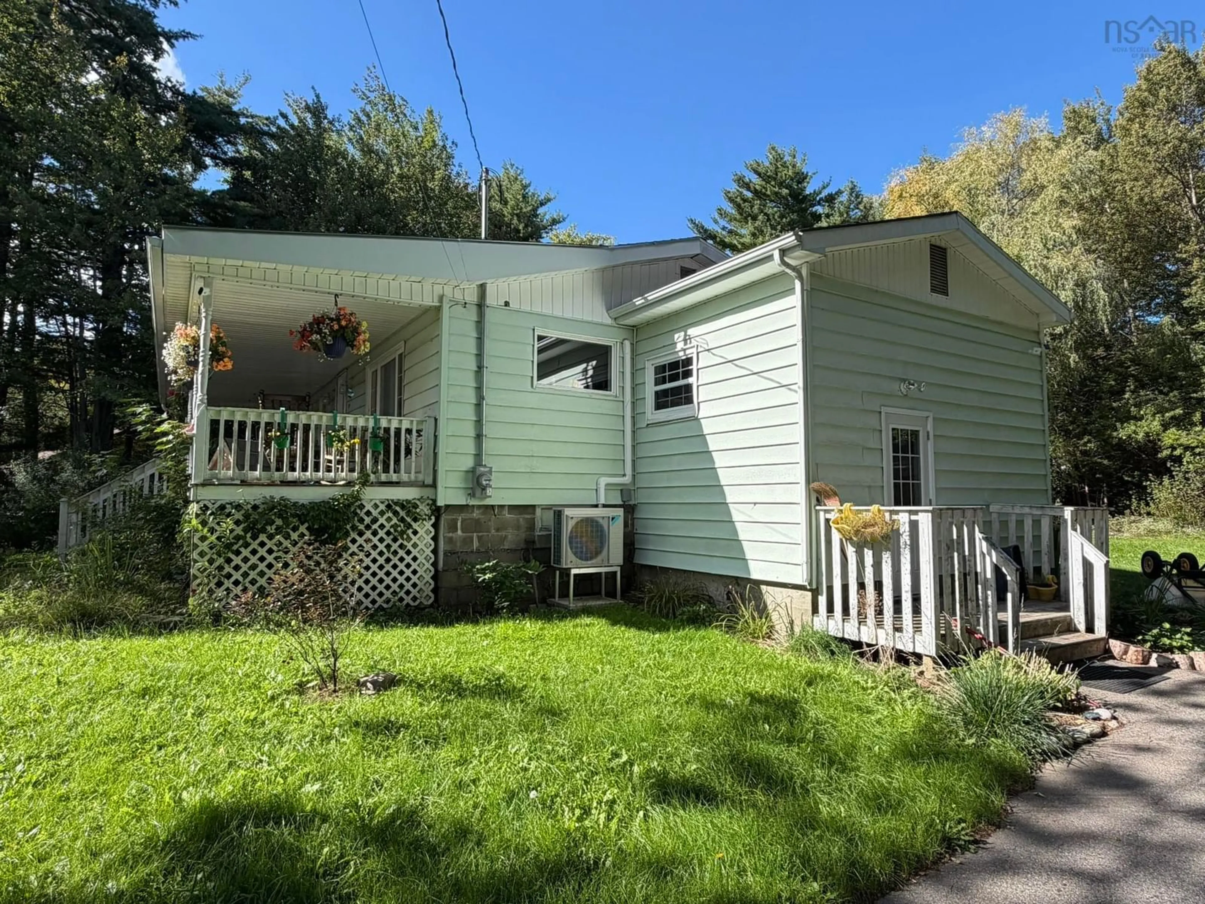 Home with vinyl exterior material, street for 19 River Rd, Milton Nova Scotia B0T 1P0