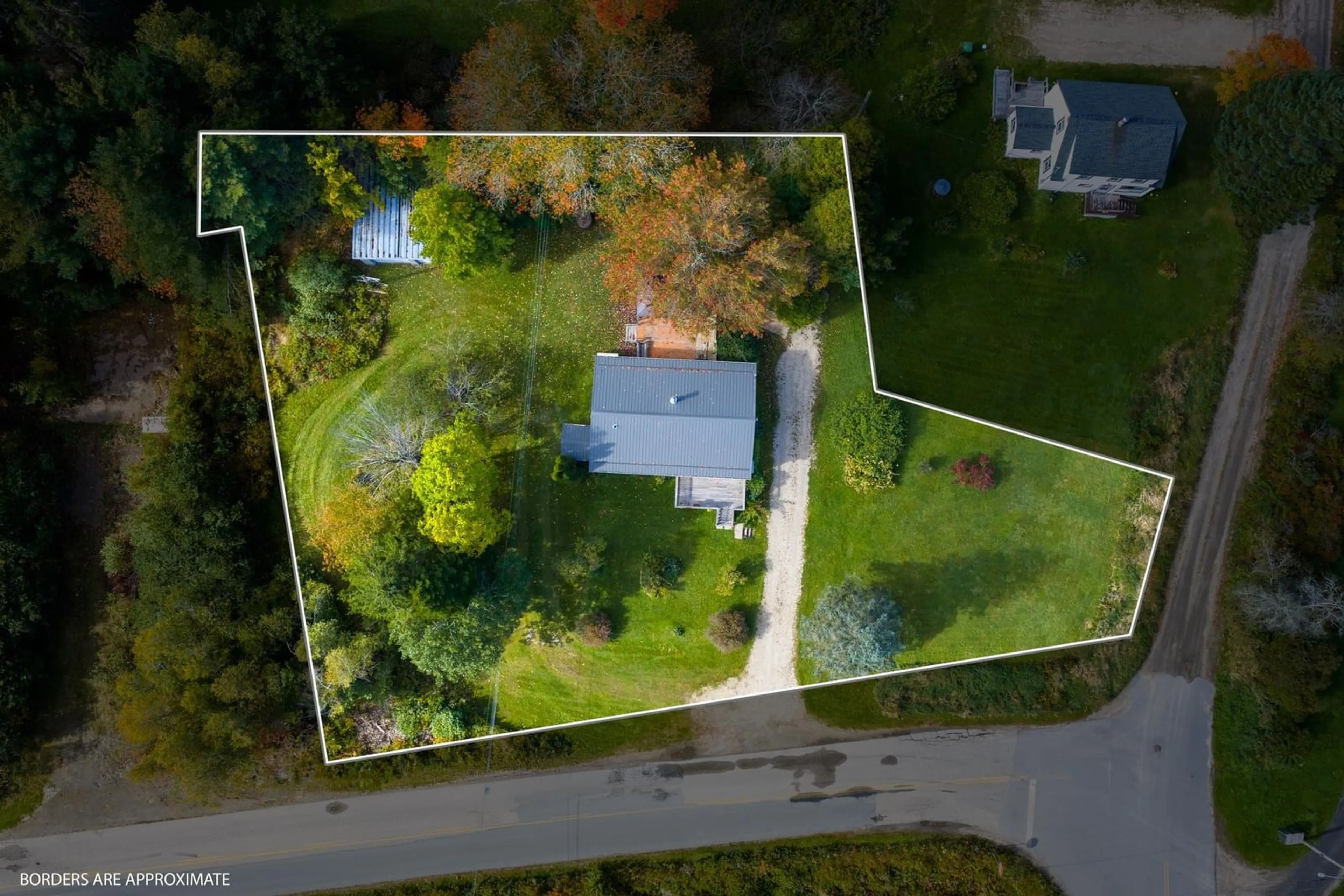 A pic from outside/outdoor area/front of a property/back of a property/a pic from drone, street for 6 North St, Western Shore Nova Scotia B0J 3M0