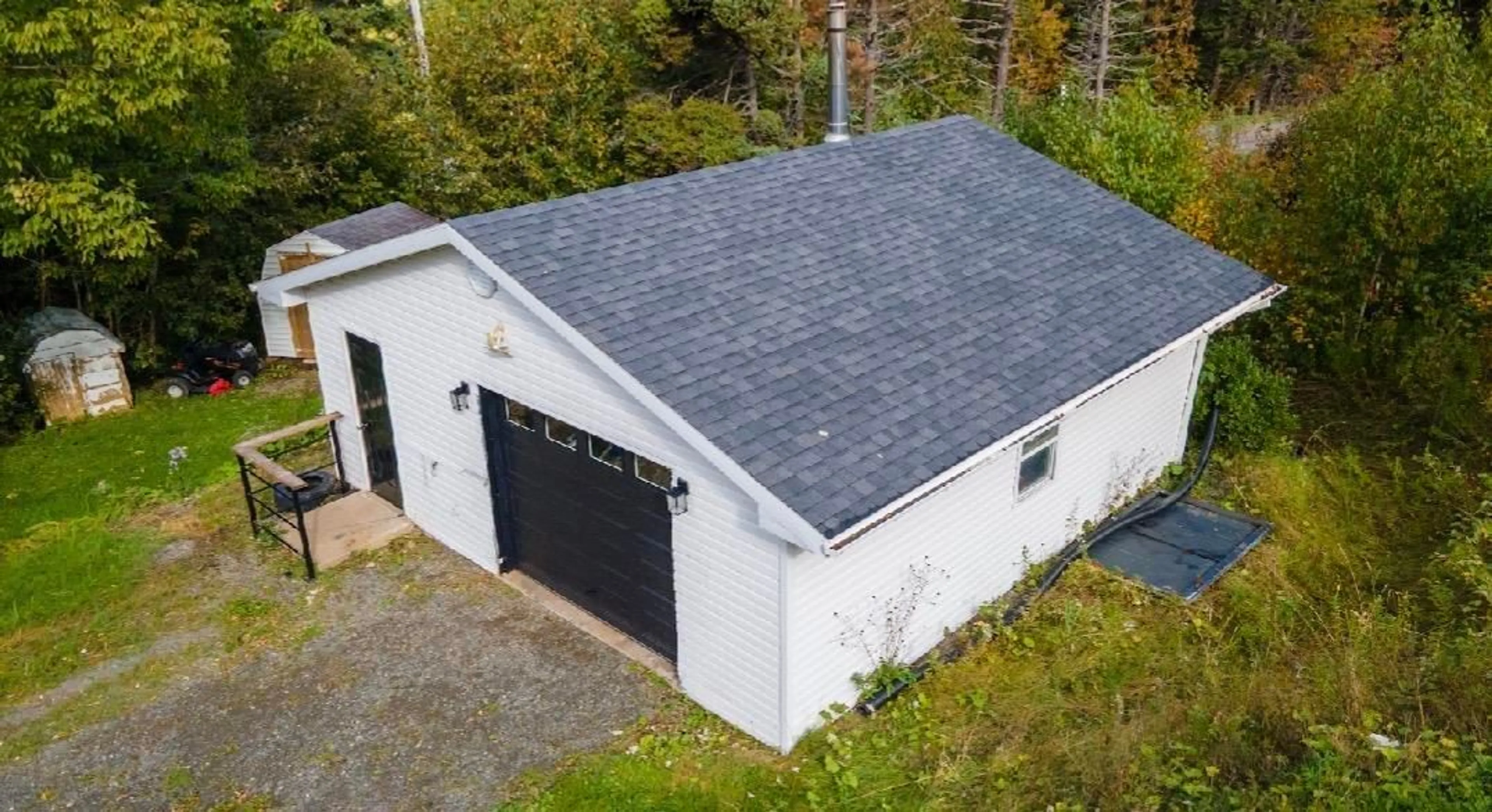 A pic from outside/outdoor area/front of a property/back of a property/a pic from drone, building for 9512 East Bay Hwy, Irishvale Nova Scotia B1J 2B2