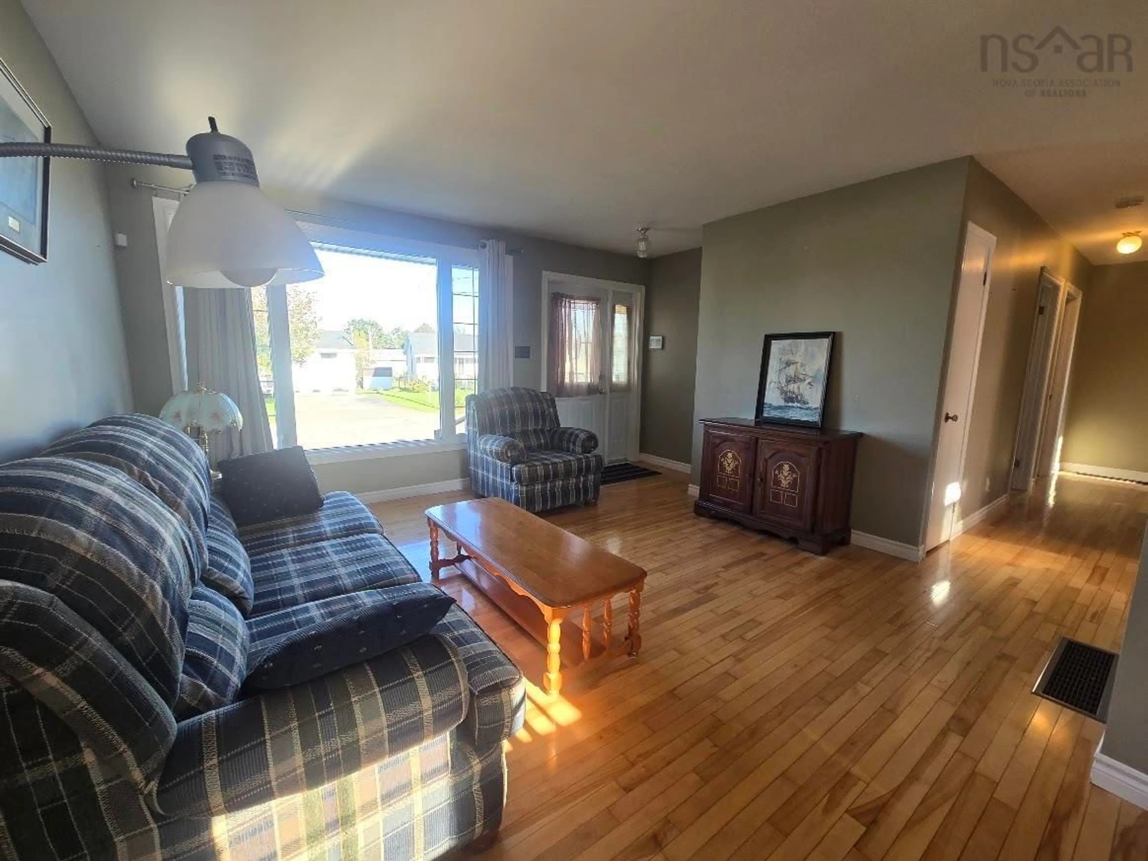 Living room with furniture, wood/laminate floor for 383 - 393 Welsford Street, Pictou Nova Scotia B0K 1H0