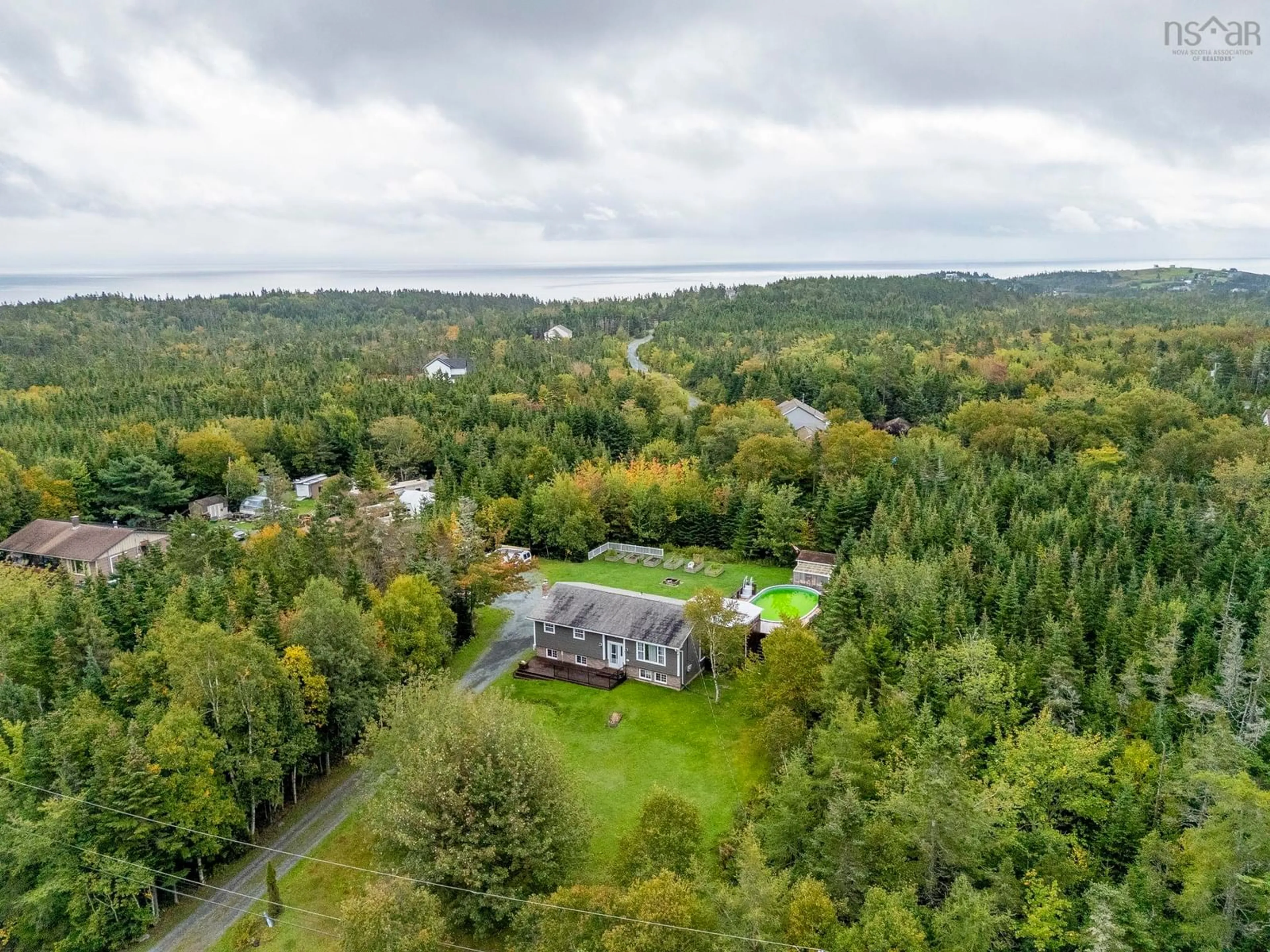 A pic from outside/outdoor area/front of a property/back of a property/a pic from drone, water/lake/river/ocean view for 20 Flandrum Hills Rd, Cow Bay Nova Scotia B3G 1K3