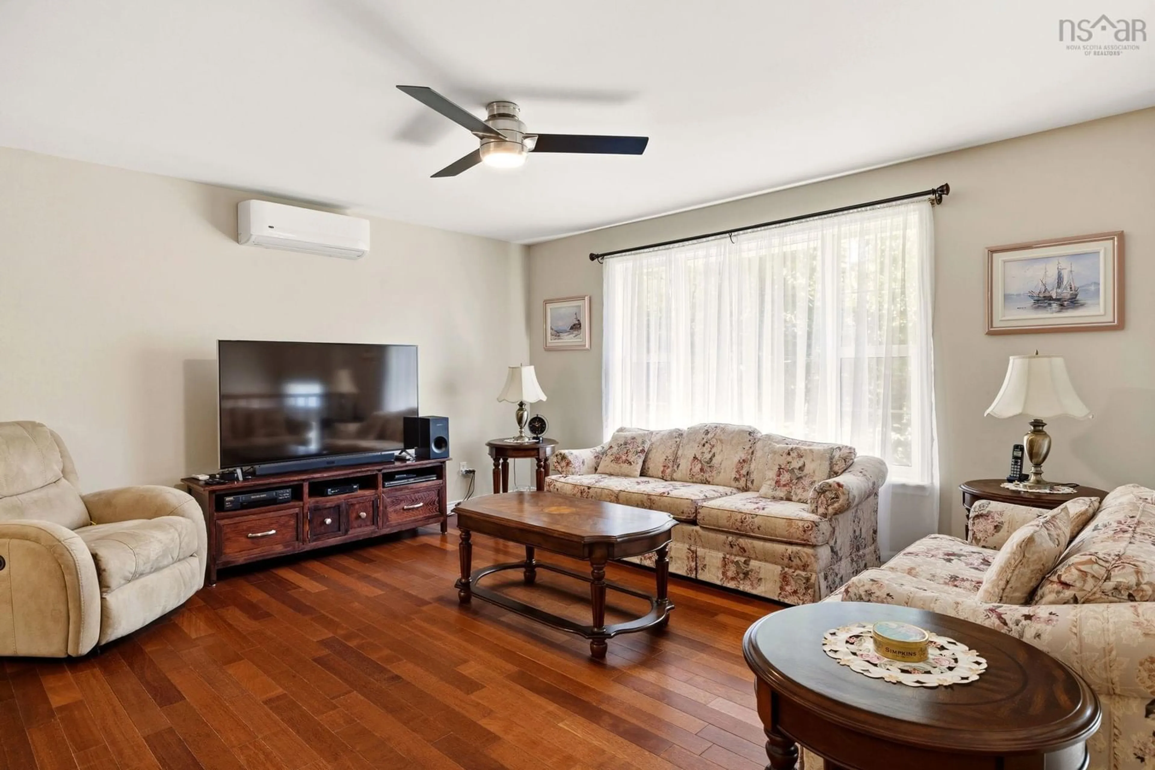 Living room with furniture, wood/laminate floor for 10 Dyke Rd, Eastern Passage Nova Scotia B3G 1K2