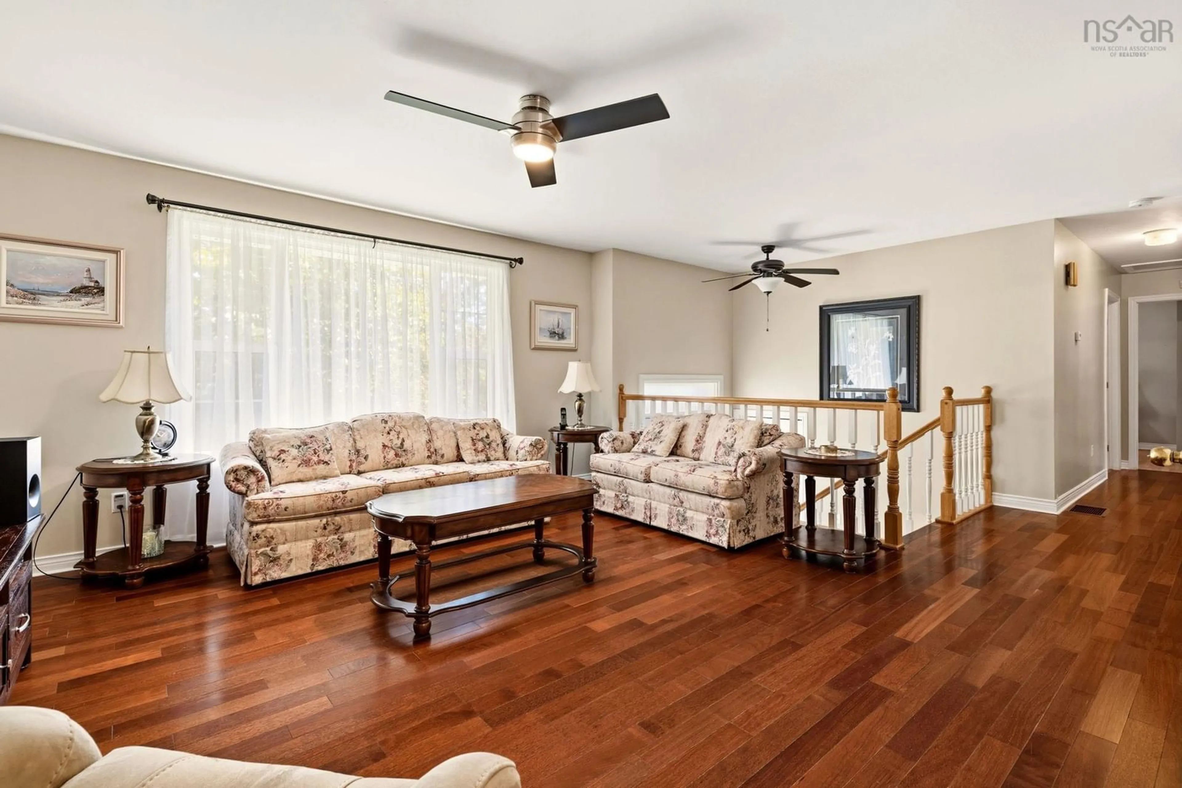 Living room with furniture, wood/laminate floor for 10 Dyke Rd, Eastern Passage Nova Scotia B3G 1K2