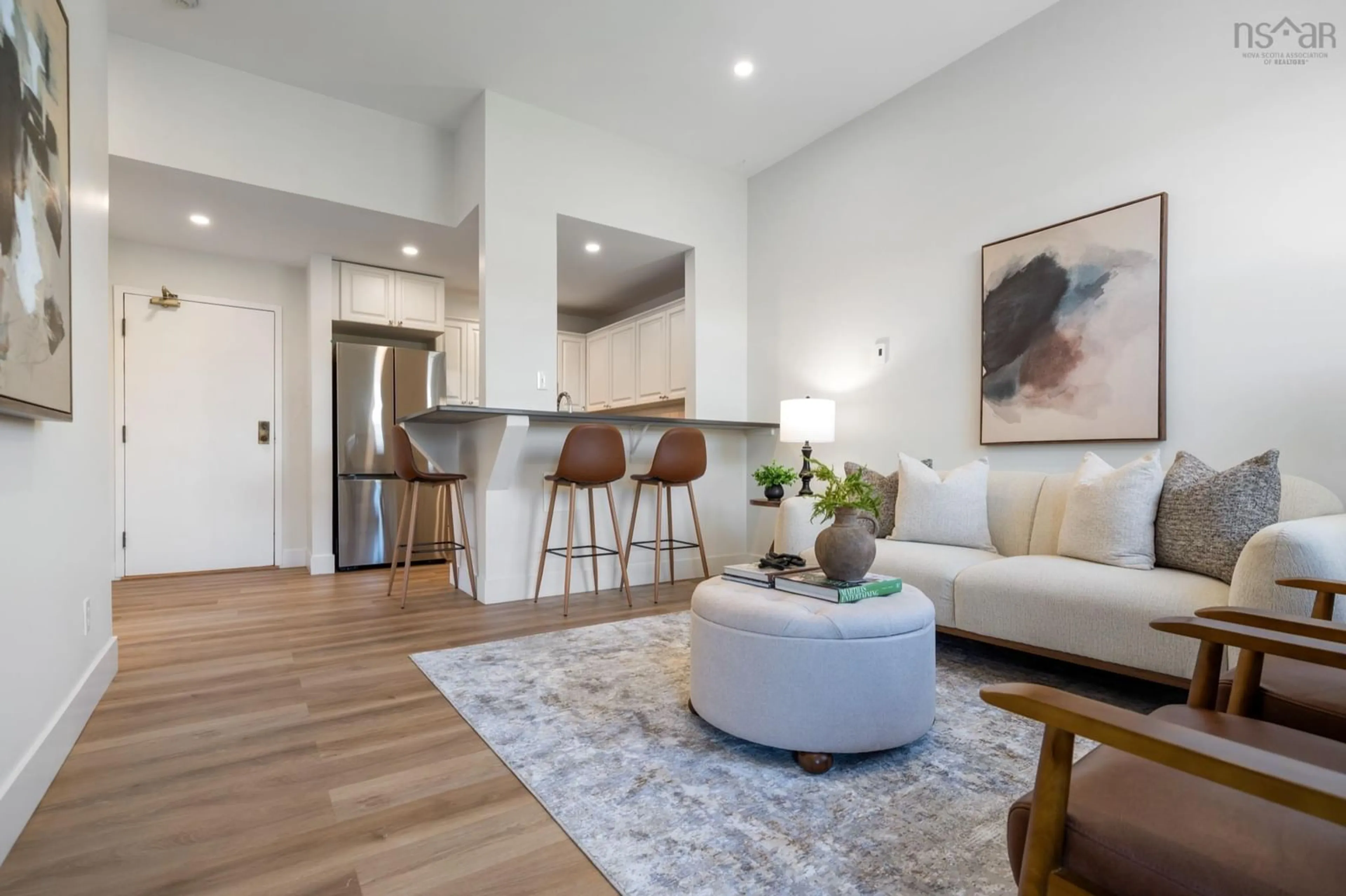 Living room with furniture, wood/laminate floor for 215 King St #307, Bridgewater Nova Scotia B4V 1A6