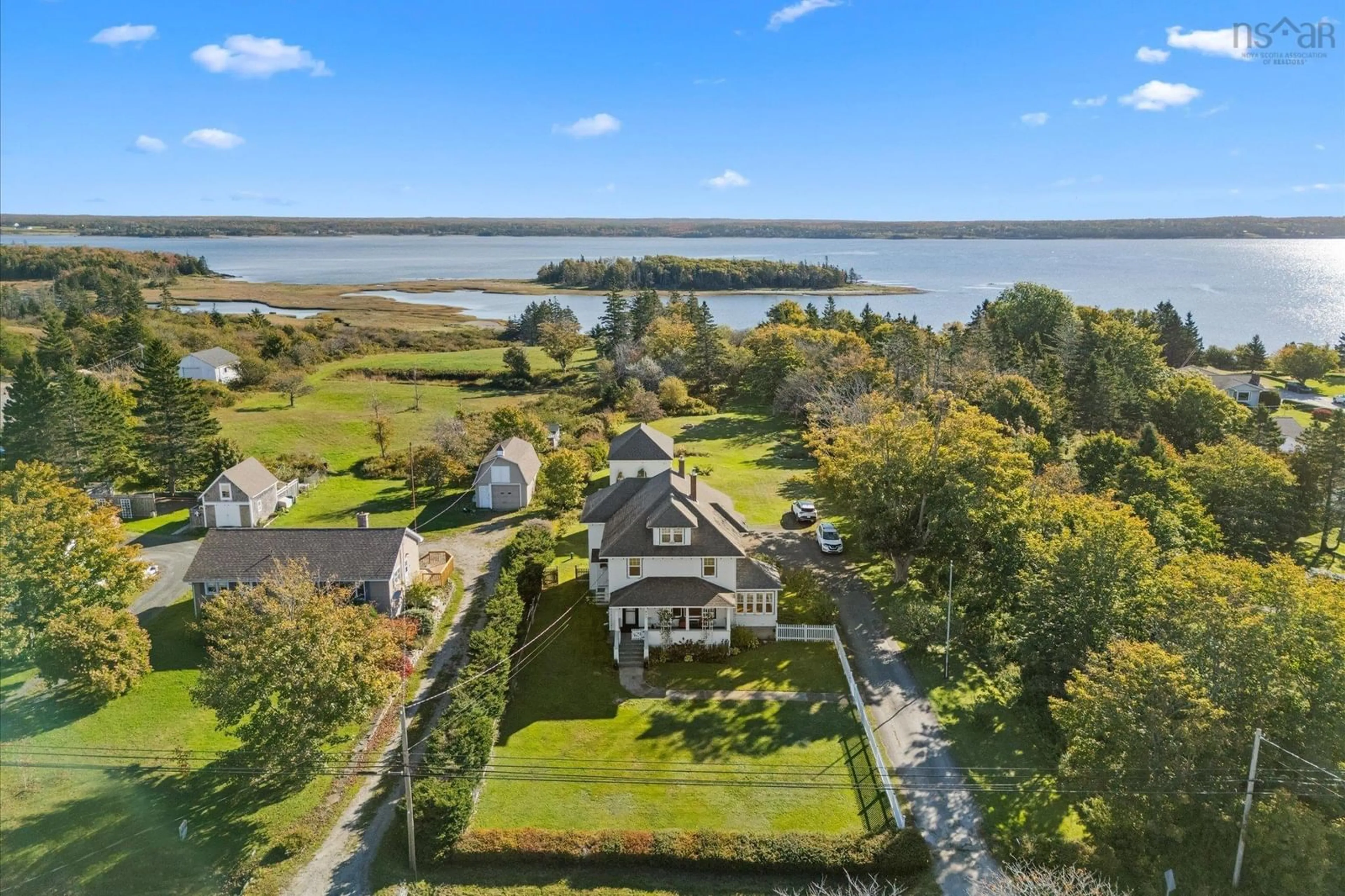 A pic from outside/outdoor area/front of a property/back of a property/a pic from drone, water/lake/river/ocean view for 917 Highway 335, West Pubnico Nova Scotia B0W 3S0