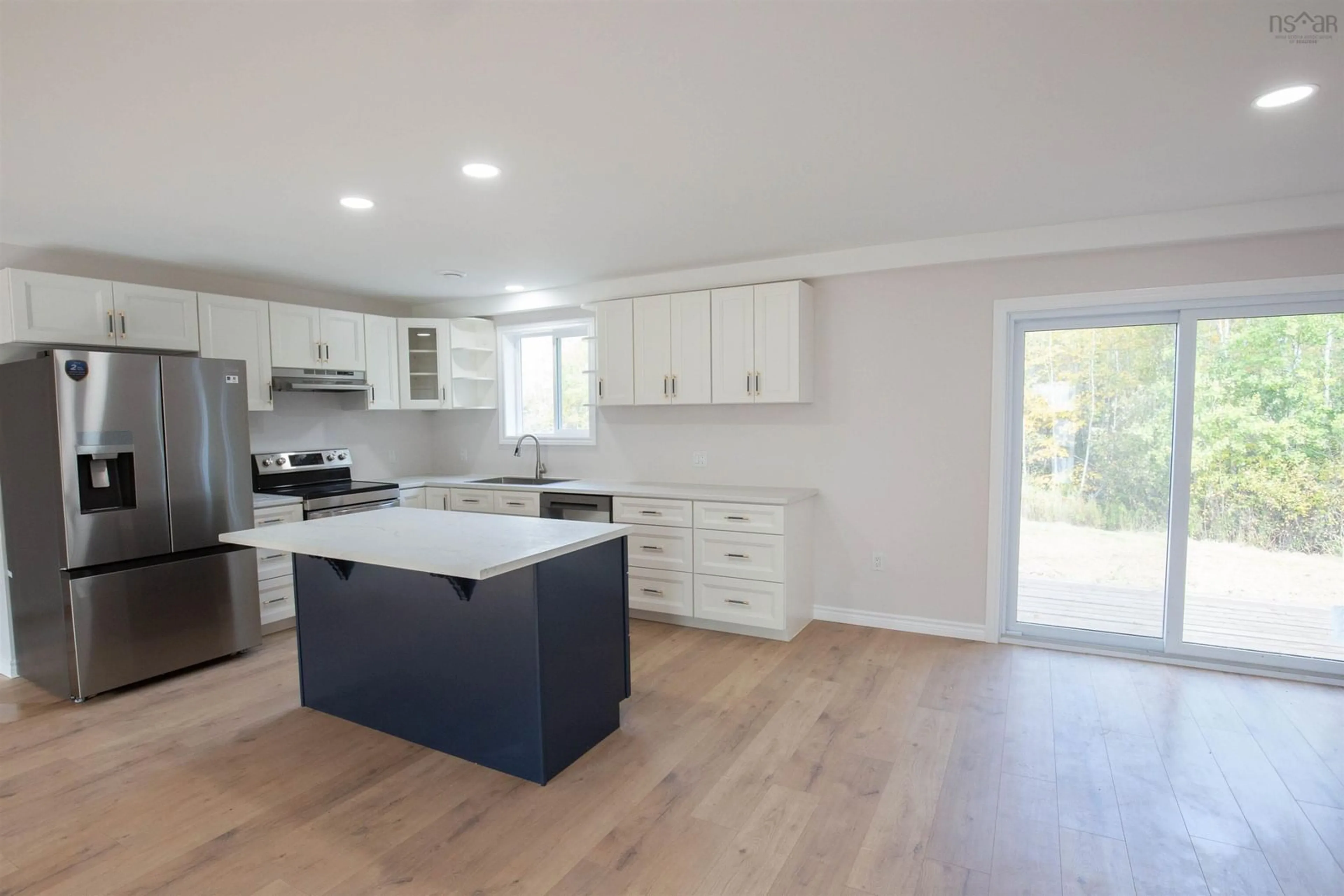 Open concept kitchen, wood/laminate floor for 2028 Lake Road, Tatamagouche Nova Scotia B0K 1V0