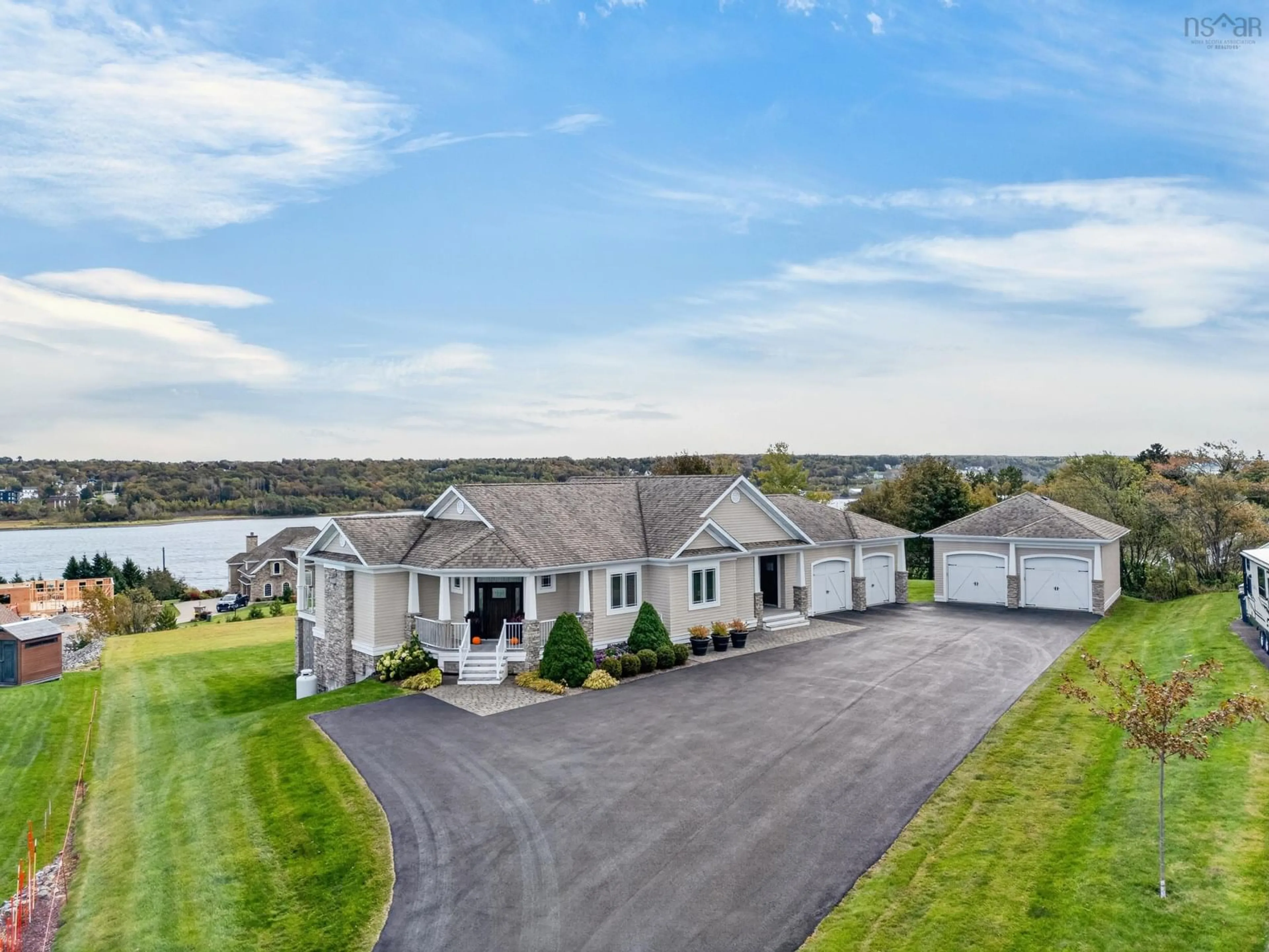 A pic from outside/outdoor area/front of a property/back of a property/a pic from drone, water/lake/river/ocean view for 18 Clipper Crt, Westmount Nova Scotia B1R 0A6