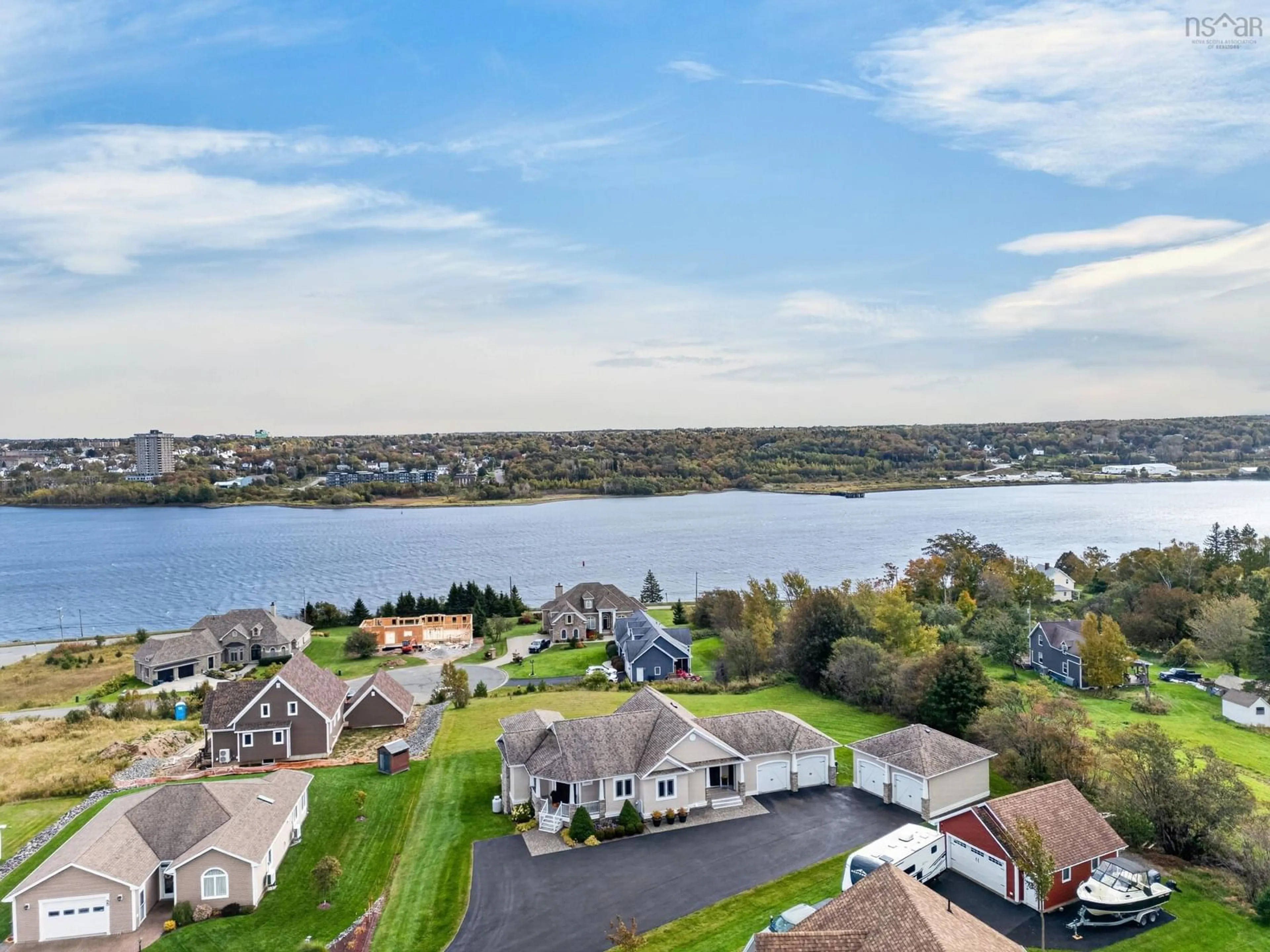 A pic from outside/outdoor area/front of a property/back of a property/a pic from drone, water/lake/river/ocean view for 18 Clipper Crt, Westmount Nova Scotia B1R 0A6